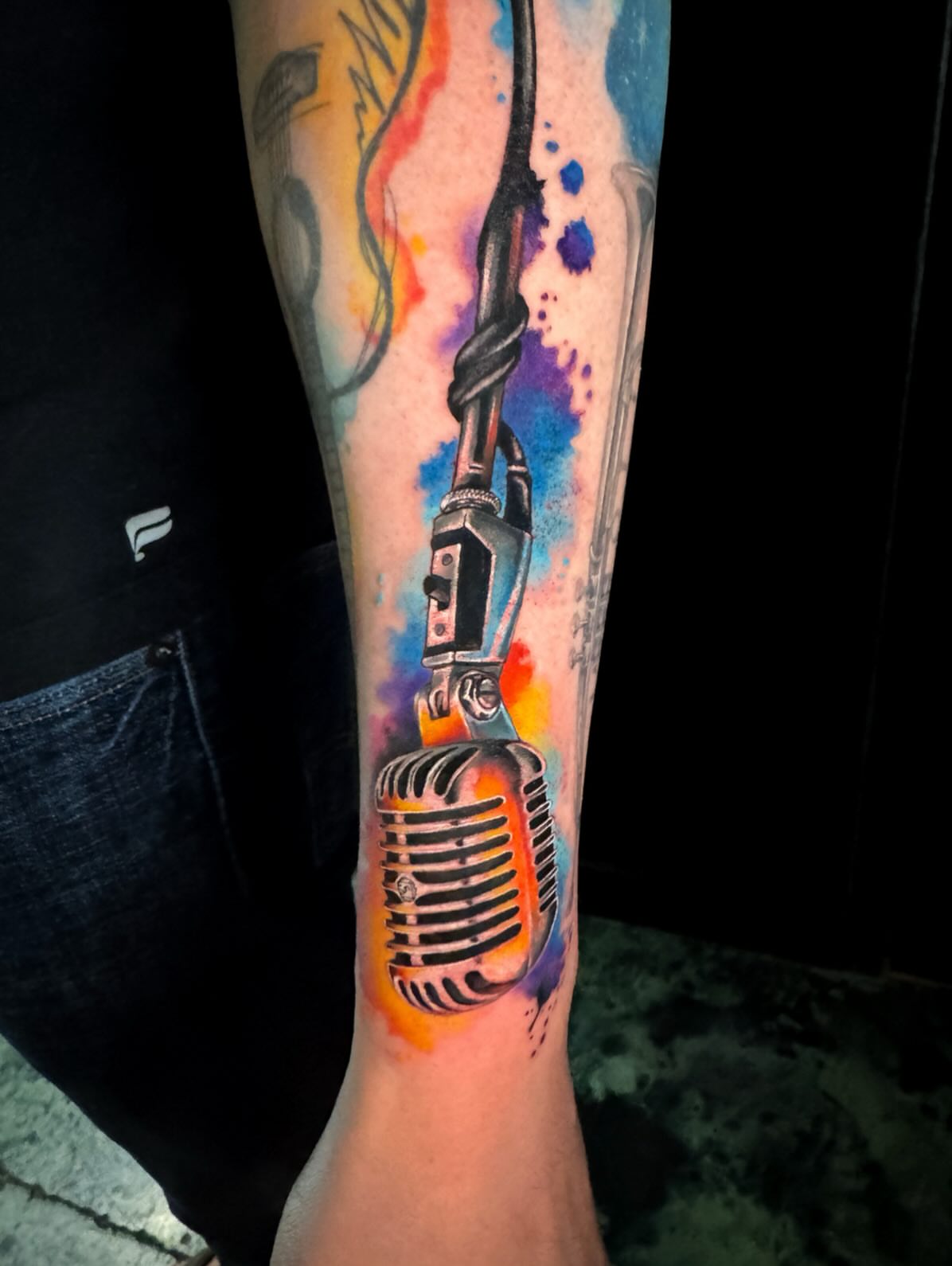 Microphone watercolor tattoo on the forearm by Violet Michelle Williams, Charlotte, North Carolina
