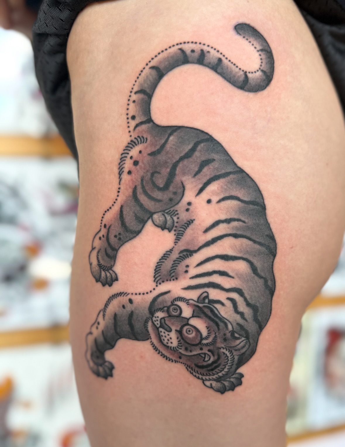 Tiger dotwork tattoo on the thigh by Jason Eisenberg