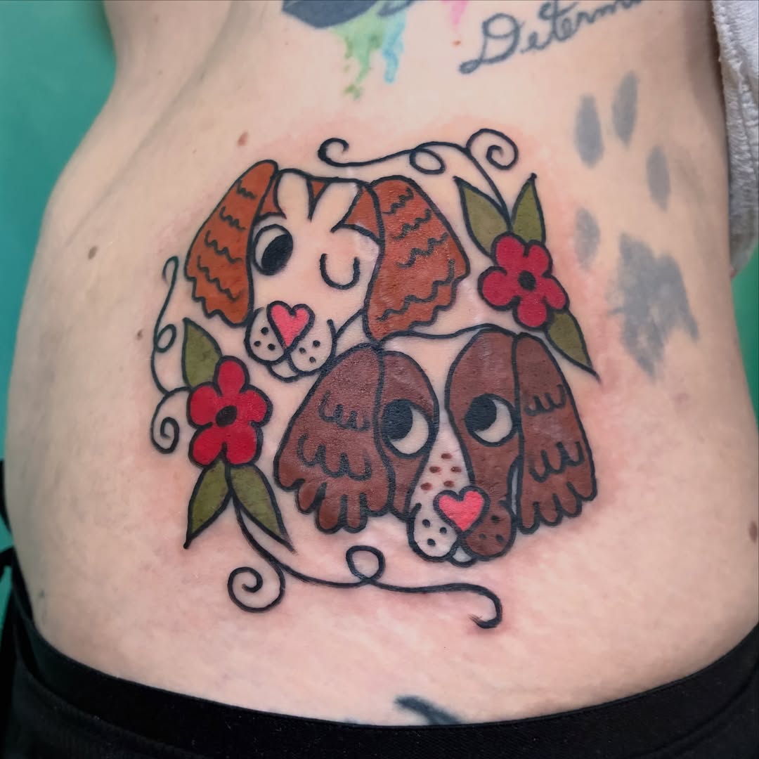 Dogs American traditional tattoo on the torso by Kaily McKee