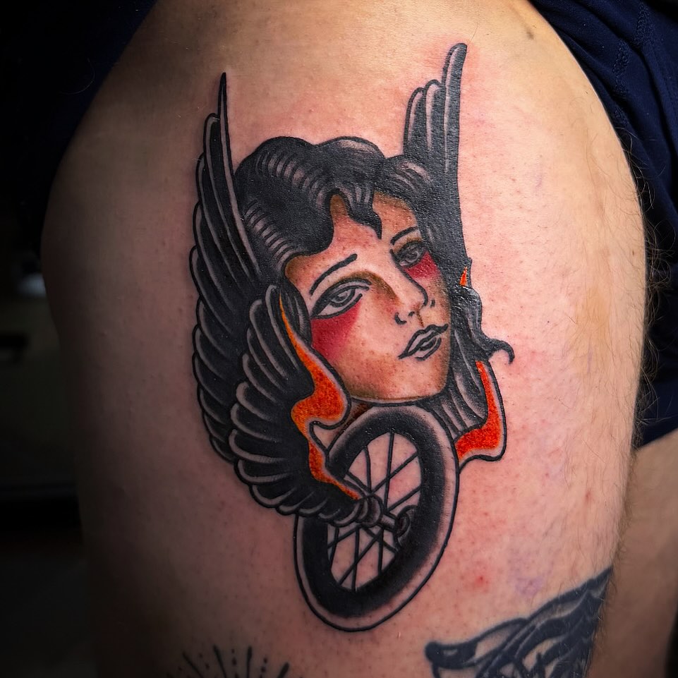 Winged woman American traditional tattoo on the shoulder by Lu Ve, Dayton, Ohio
