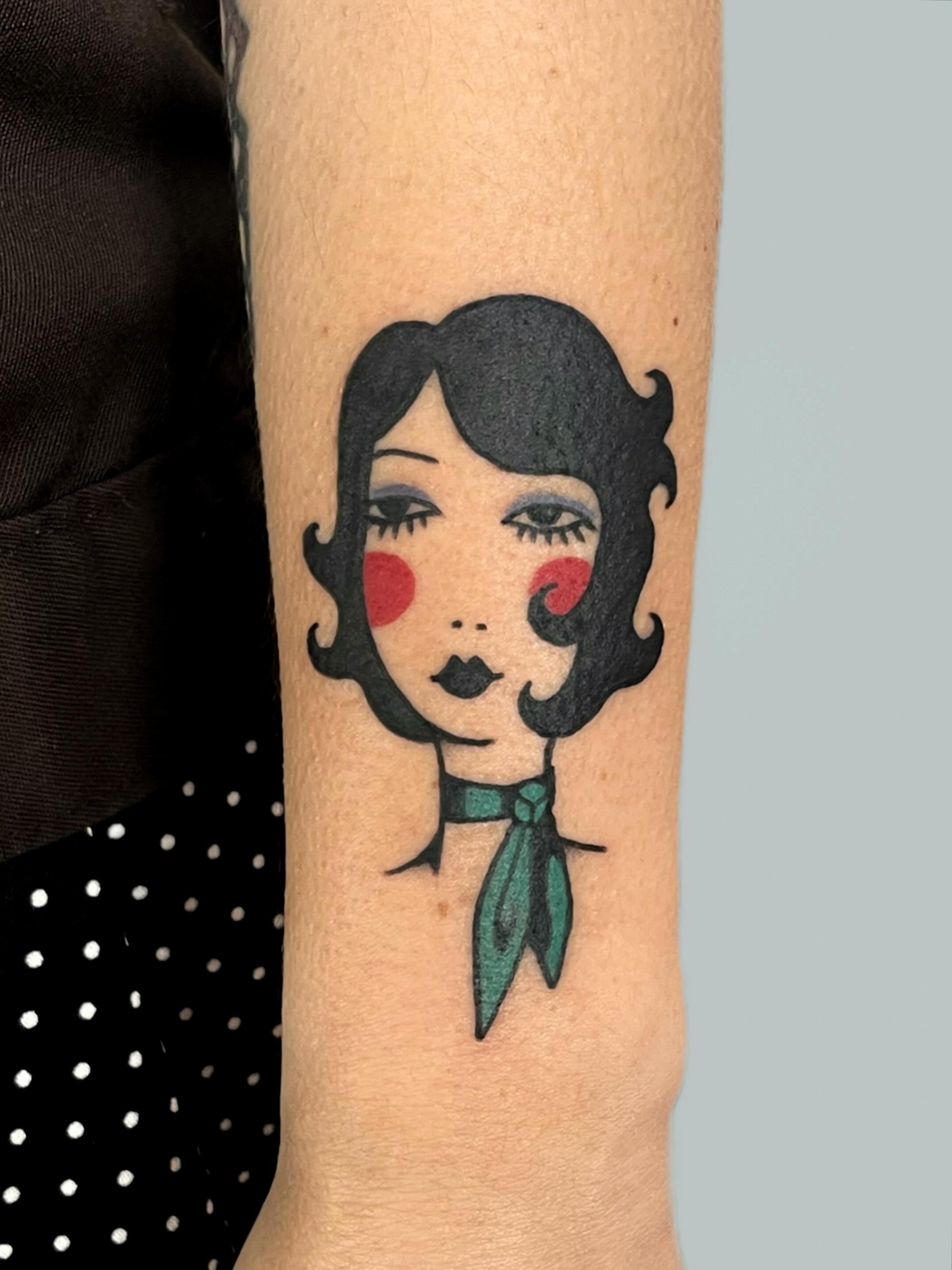 Woman with bow American traditional tattoo on the forearm by nina