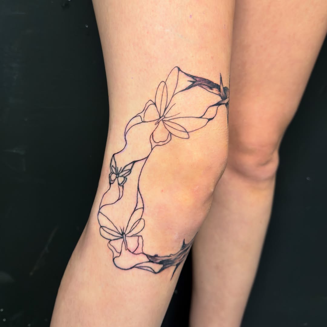 Orchid fine line tattoo on the forearm by David Yancy III