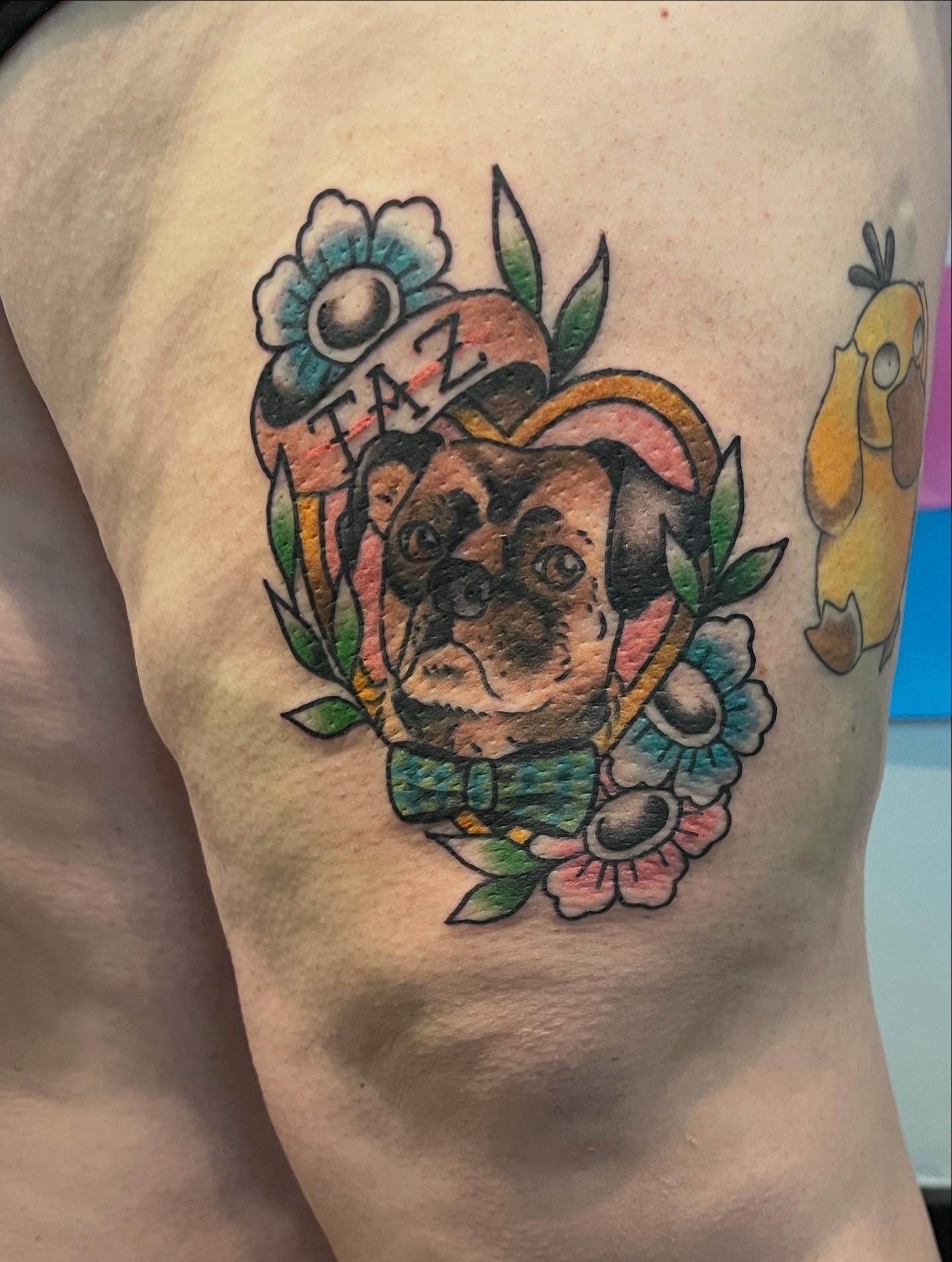 Pug with flowers American traditional tattoo on the thigh by 🖤Jess Pereira🖤, Framingham, Massachusetts