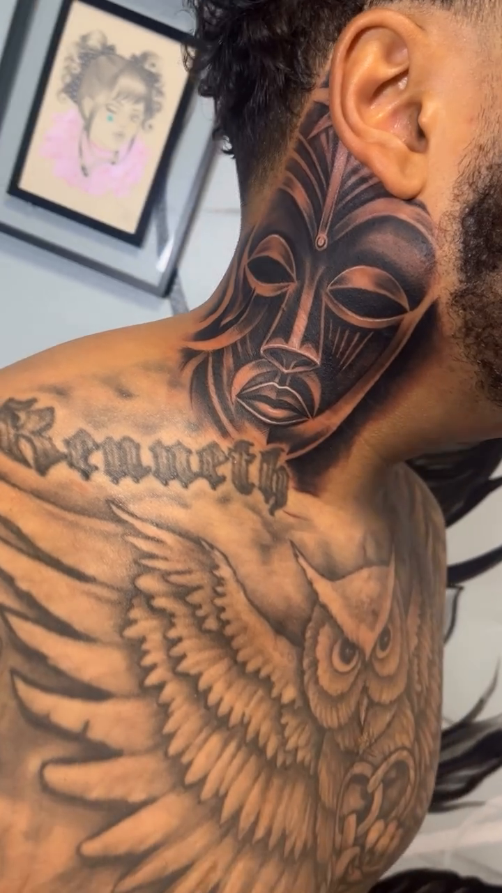 Tribal mask on neck realism tattoo on the neck by Yulia Chekir, Chicago, Illinois