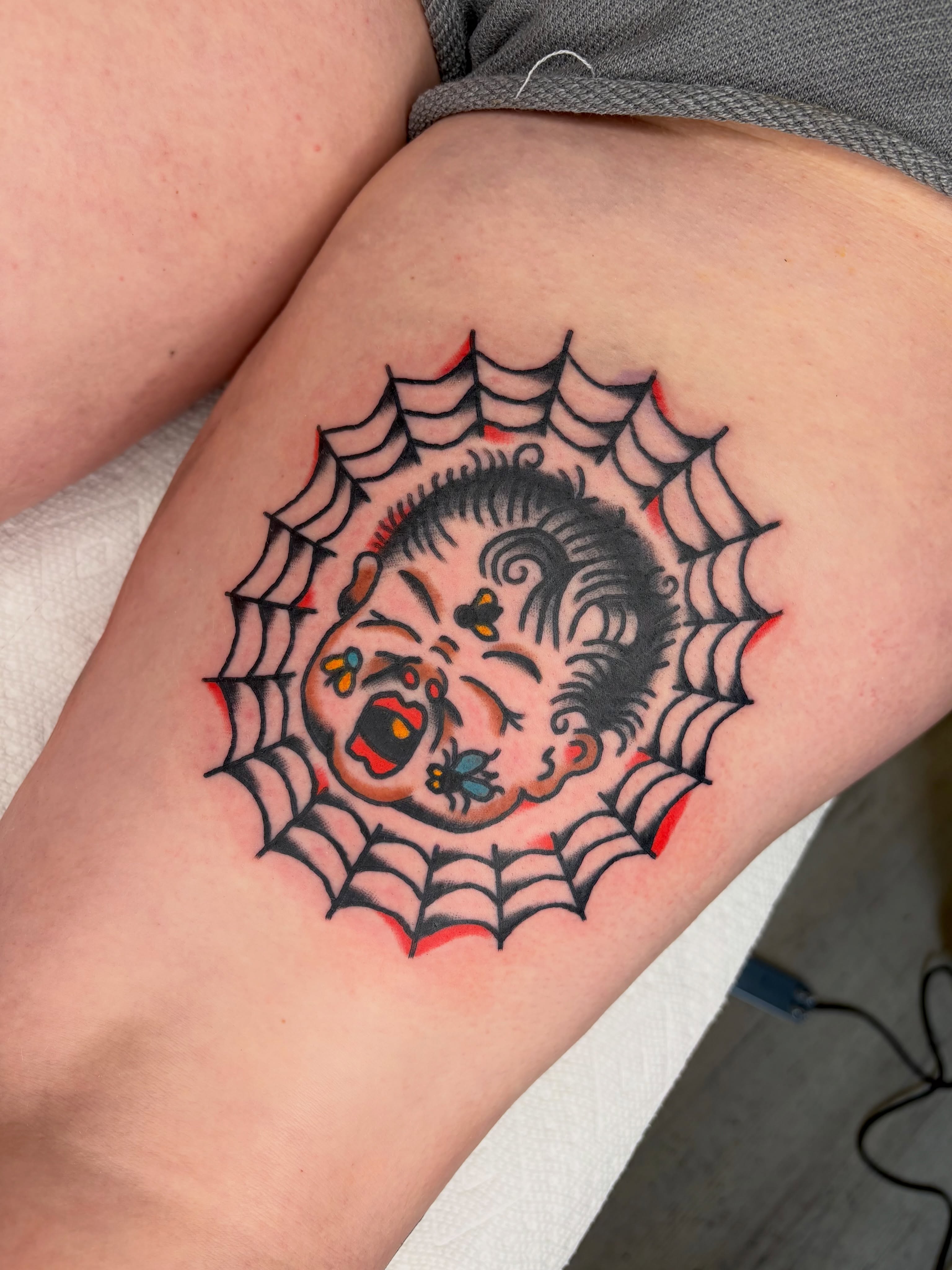 Baby in spider web American traditional tattoo on the forearm by Braedon 🎱