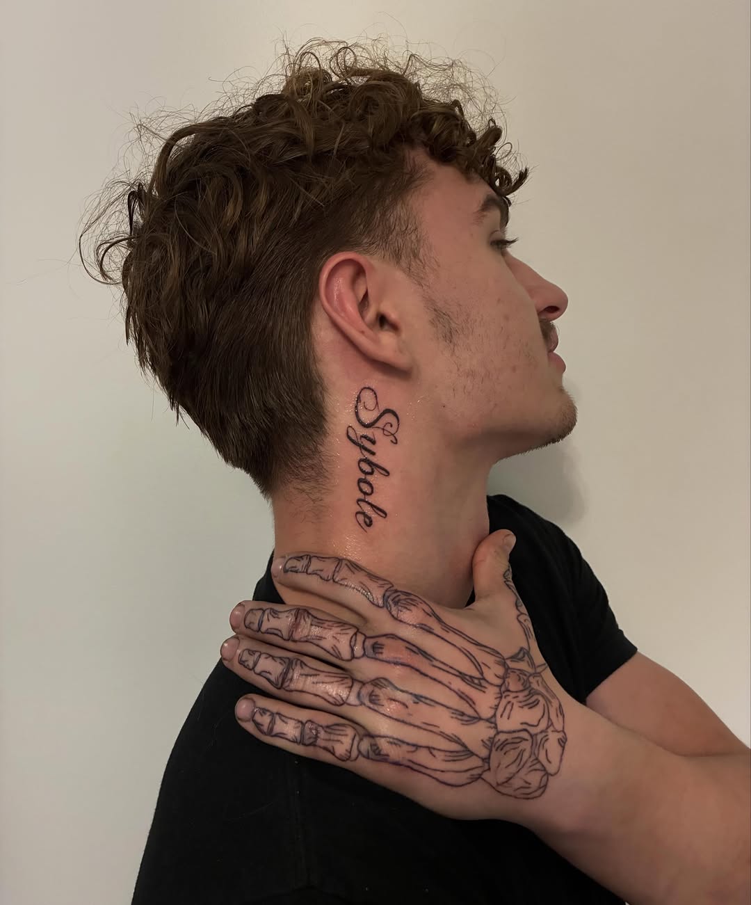 Skeleton hand and neck script sketch tattoo on the neck by Lexie Decker, Canton, Ohio