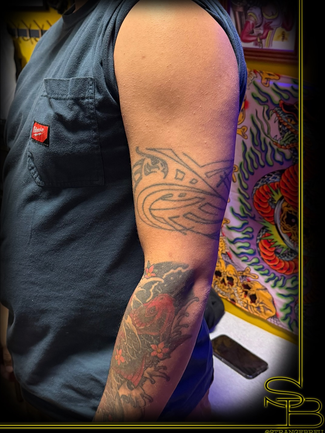 Koi fish American traditional tattoo on the forearm by Chris Breuer, Asbury Park, New Jersey