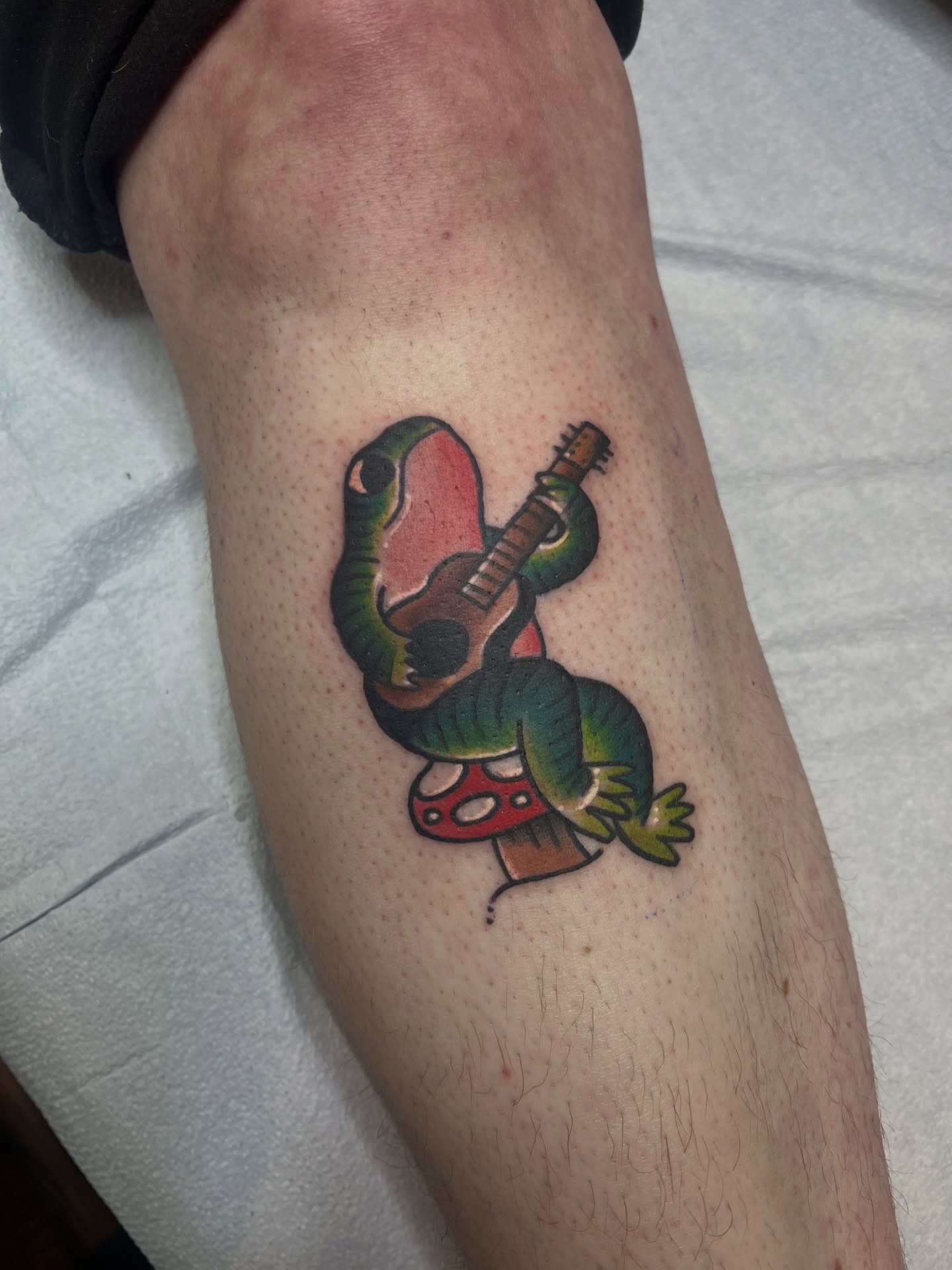 Snake and guitar American traditional tattoo on the forearm by Fizzy Jizzles, Worcester, England