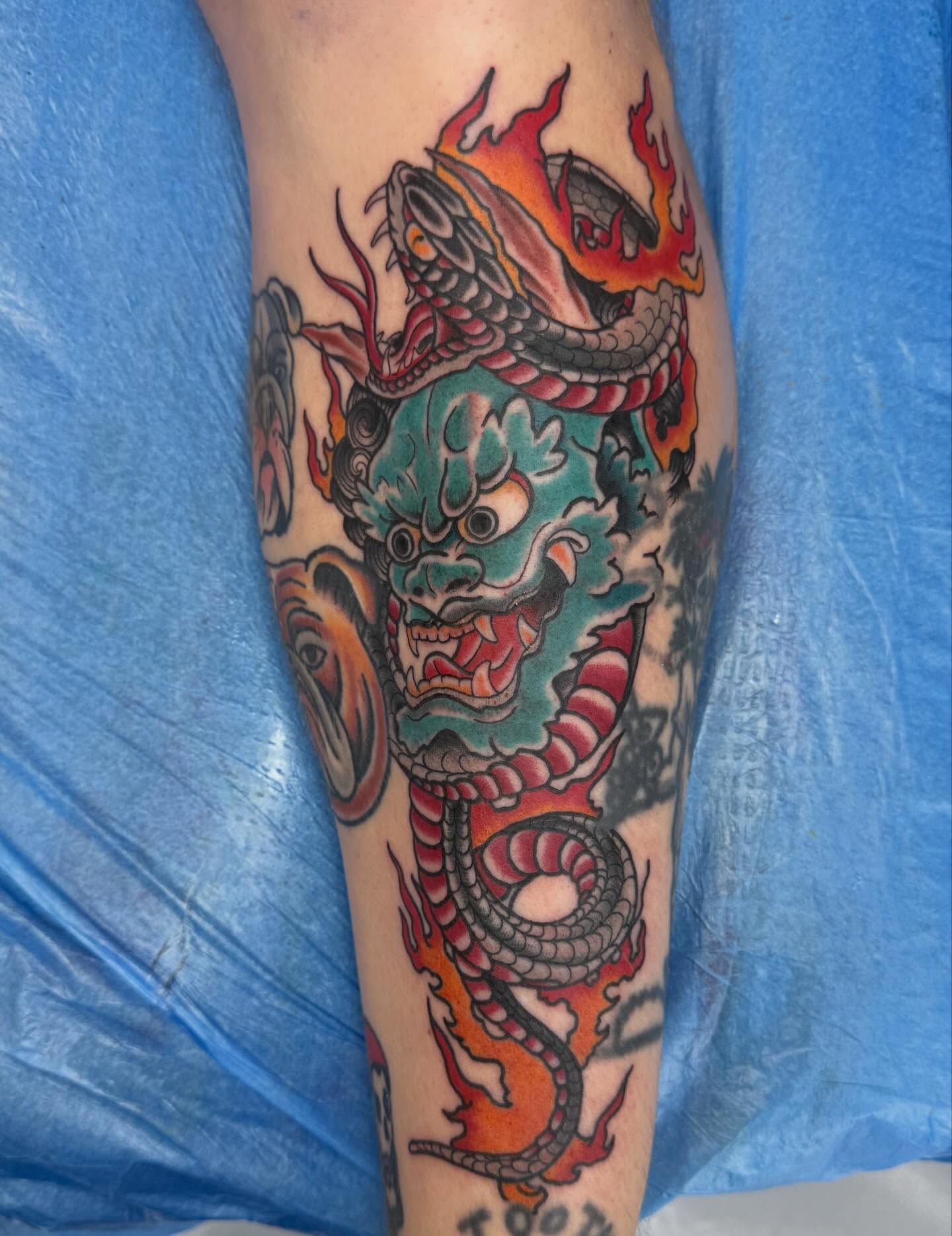 Dragon American traditional tattoo on the forearm by Trent Parsley