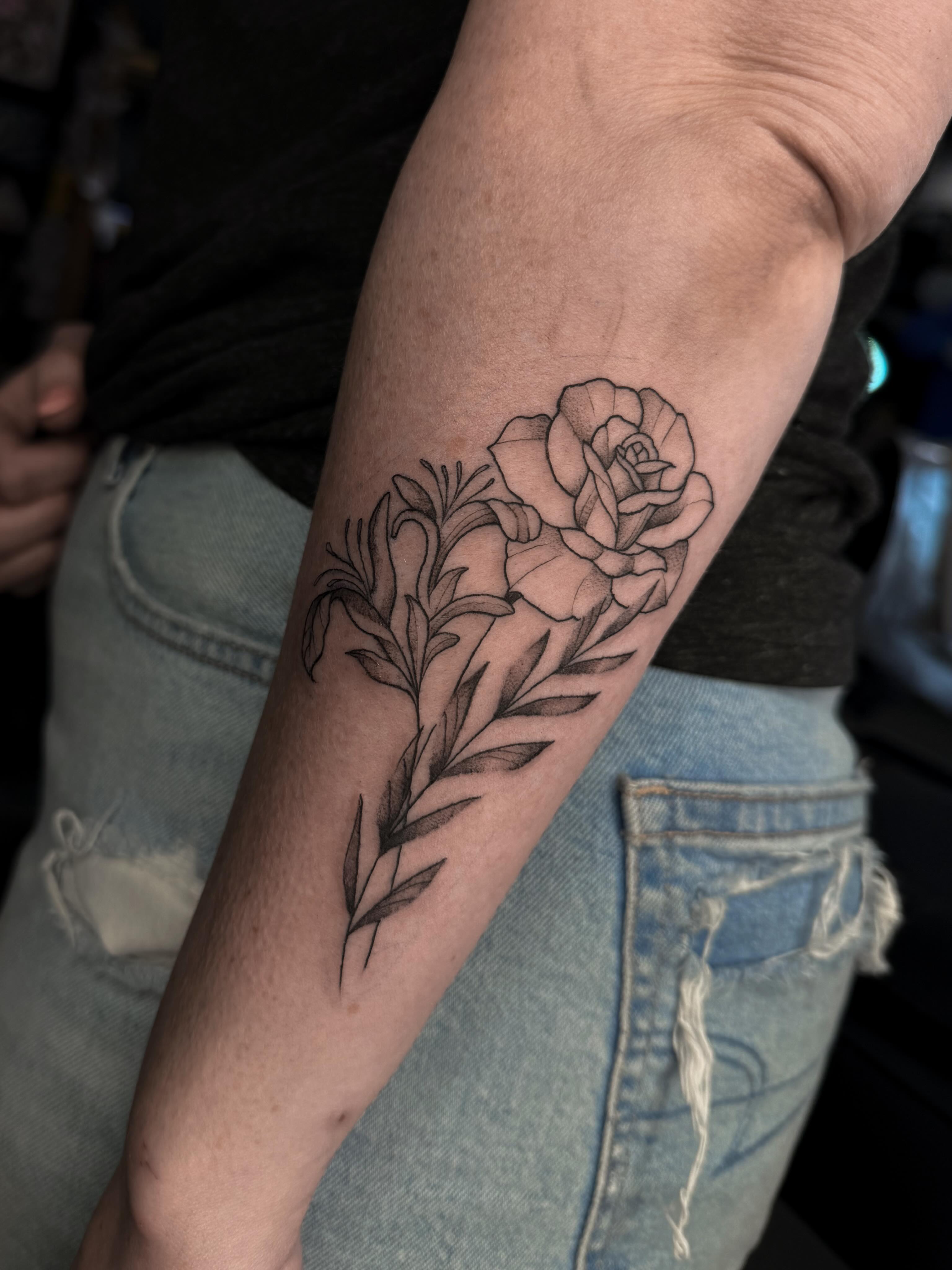 Rose black and grey tattoo on the forearm by Susie Maj