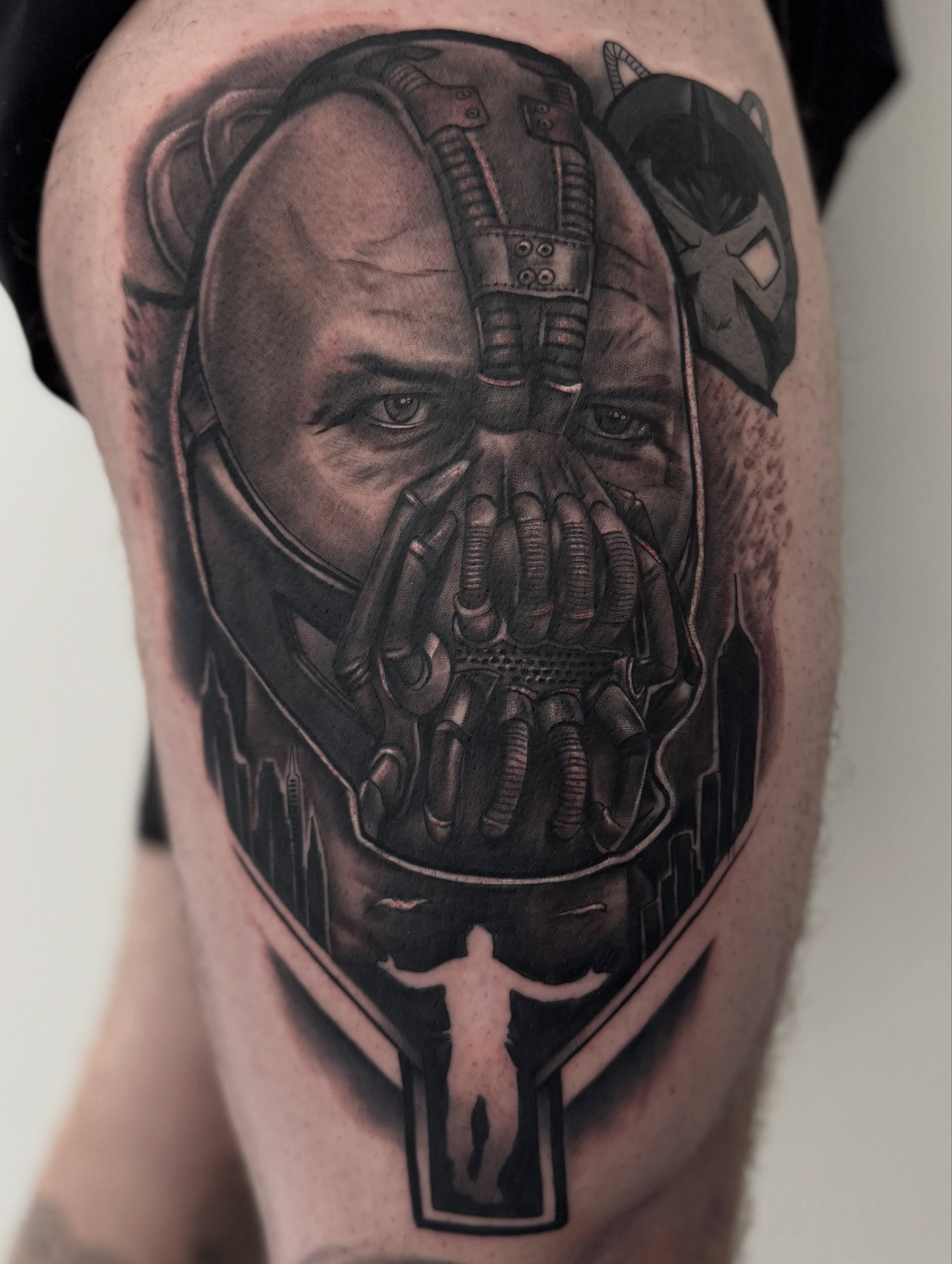 Bane mask realism tattoo on the thigh by Jaxx Kesler
