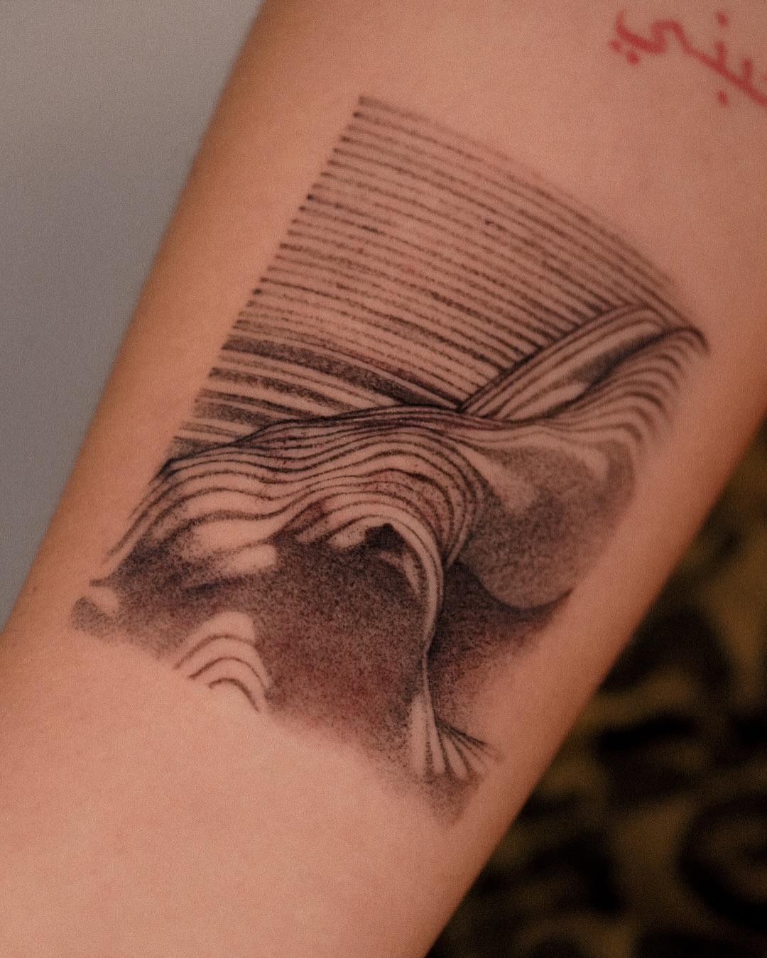 Abstract waves dotwork tattoo on the forearm by Joy Christiana