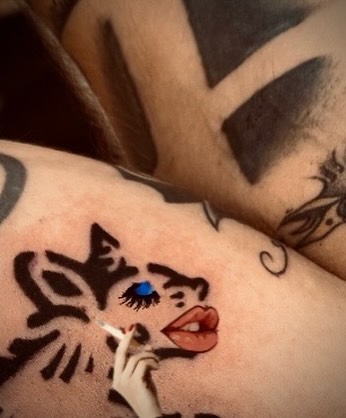 Cat American traditional tattoo on the upper arm by M
