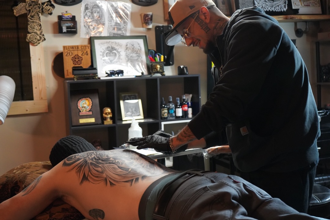 Floral design black and grey tattoo on the back by Martin Melendrez