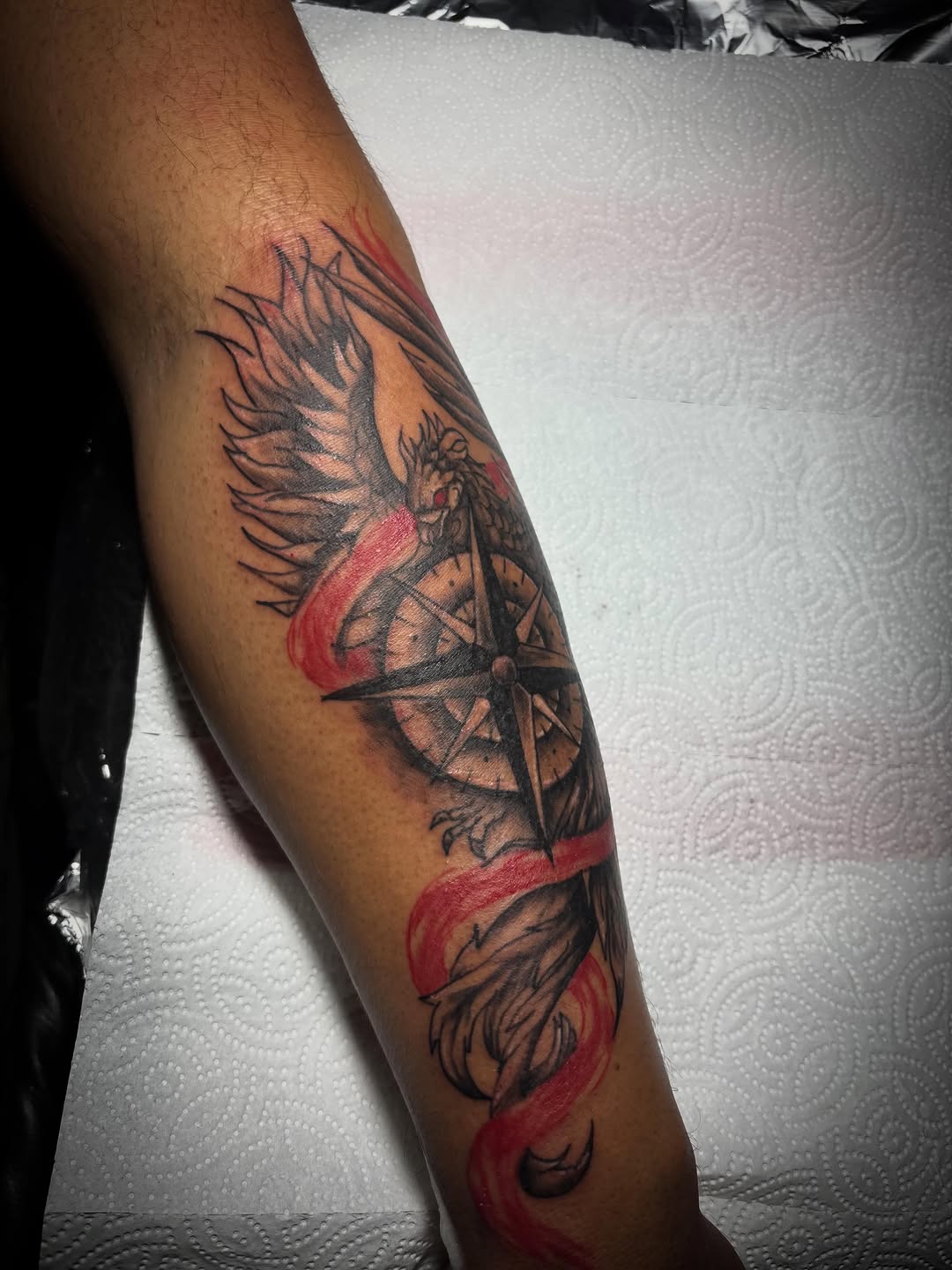 Eagle and compass realism tattoo on the forearm by Jonny Vicious