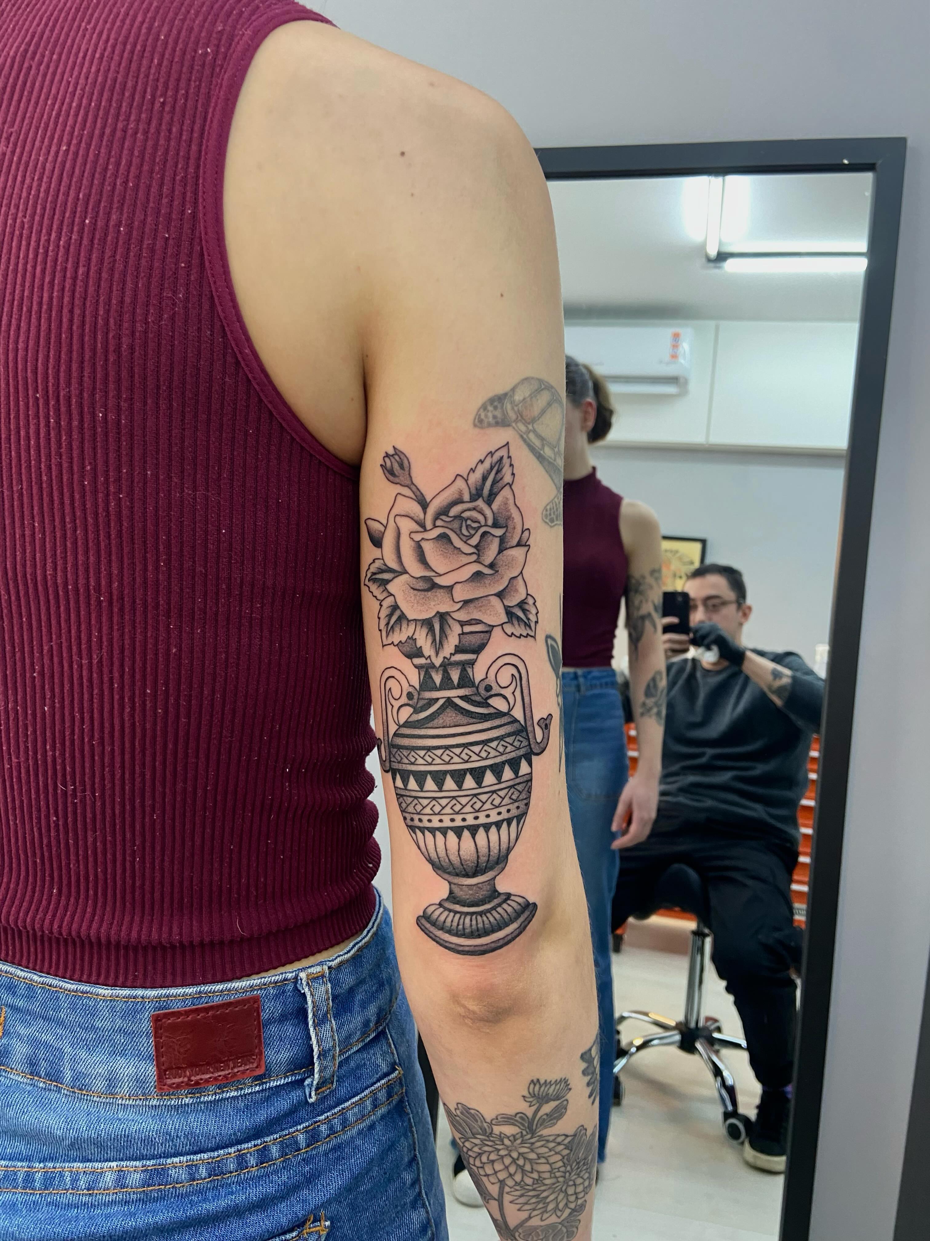Flower vase black and grey tattoo on the forearm by Lucas Naganuma