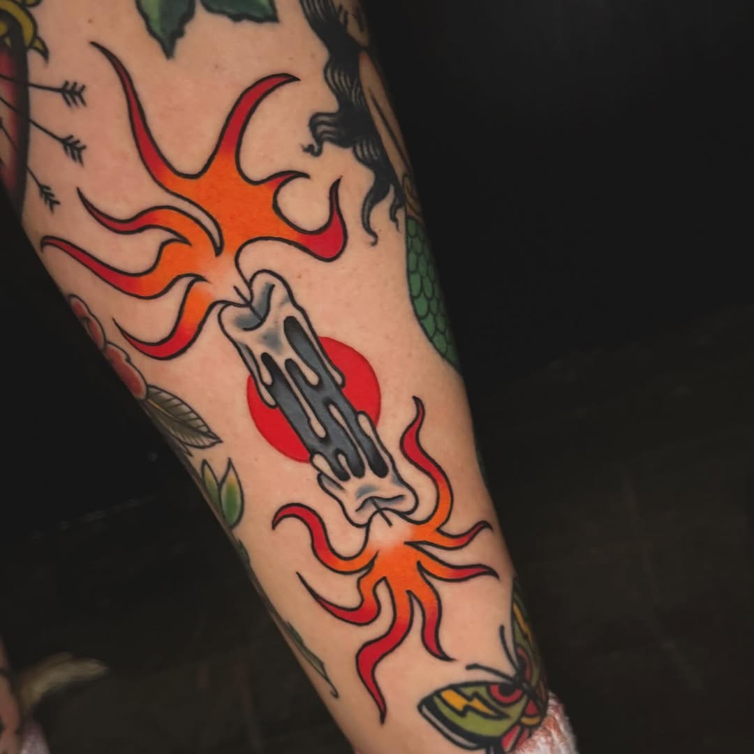 Burning candle American traditional tattoo on the forearm by Nikki Bee