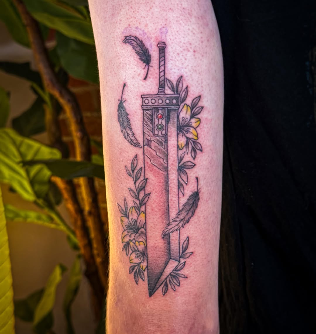 Sword and flowers black and grey tattoo on the forearm by Ash✨