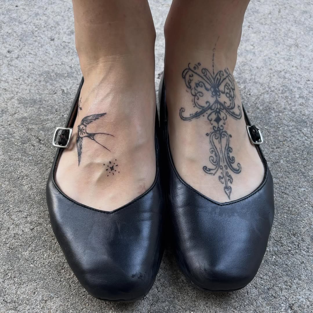 Swallow and ornamental design tattoo on the foot by elizaveta