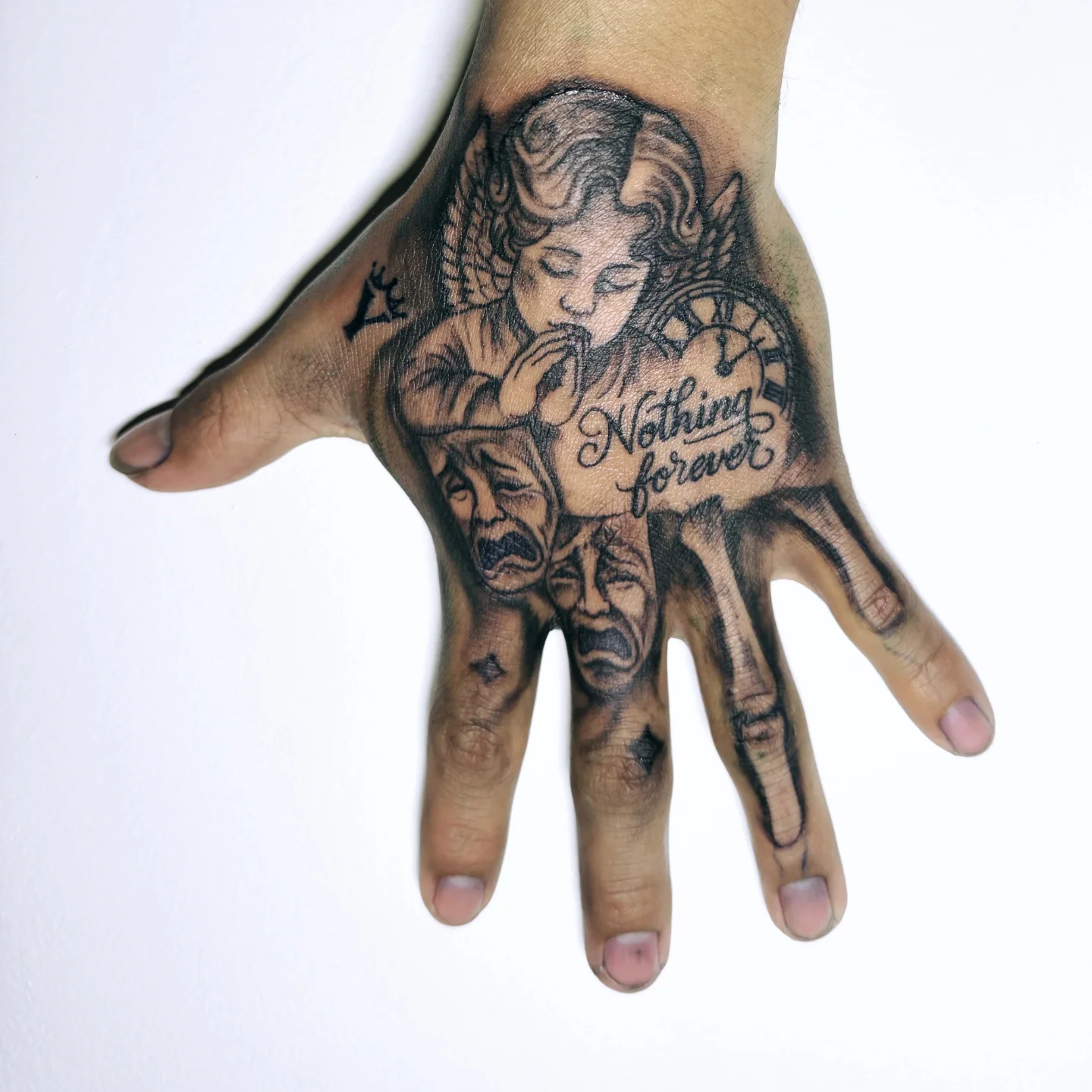 Angel with clock realism tattoo on the hand by Miami Beach Tattoo Artist