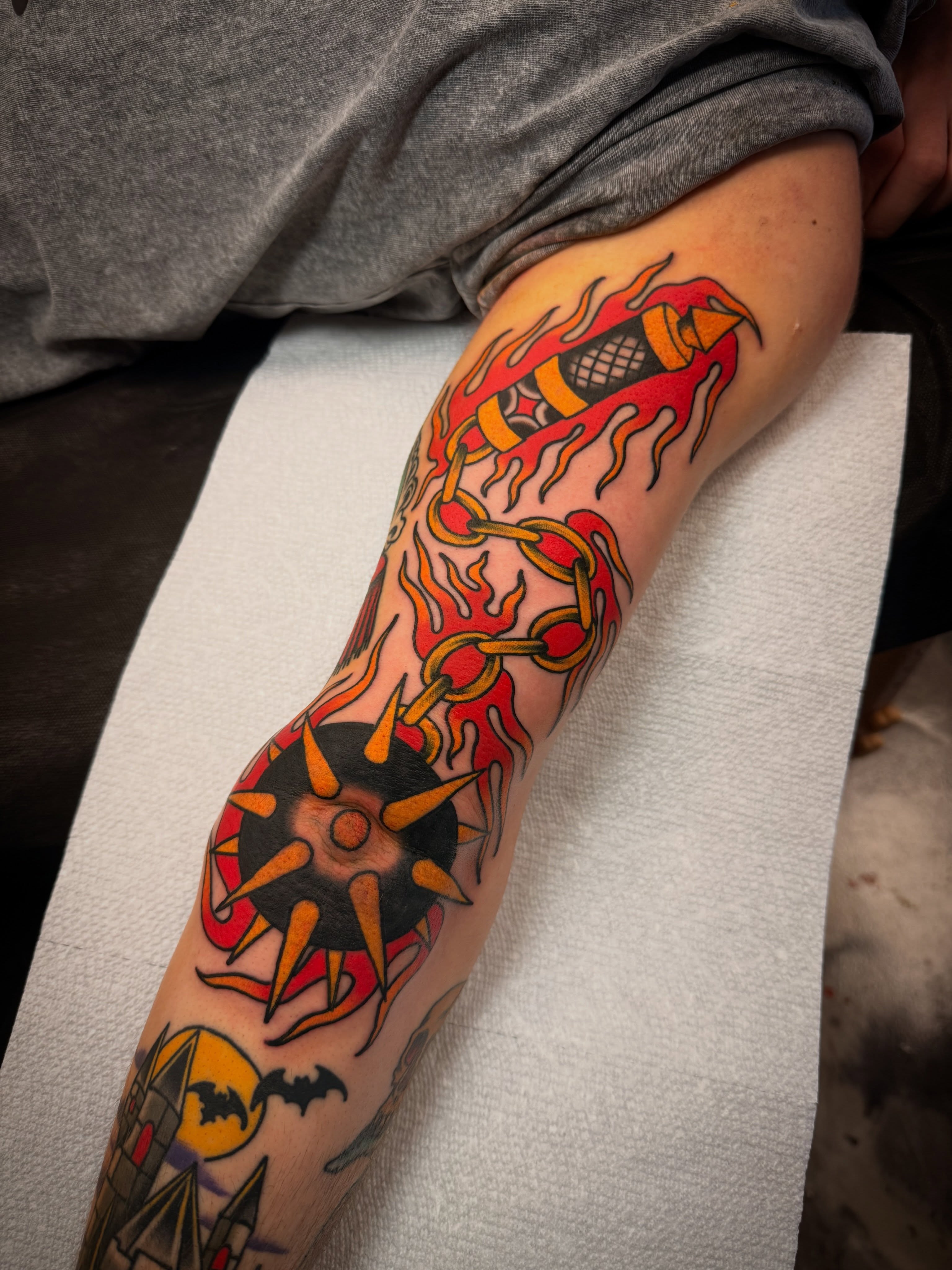 Flame and chain American traditional tattoo on the forearm by Dave Osrowitz