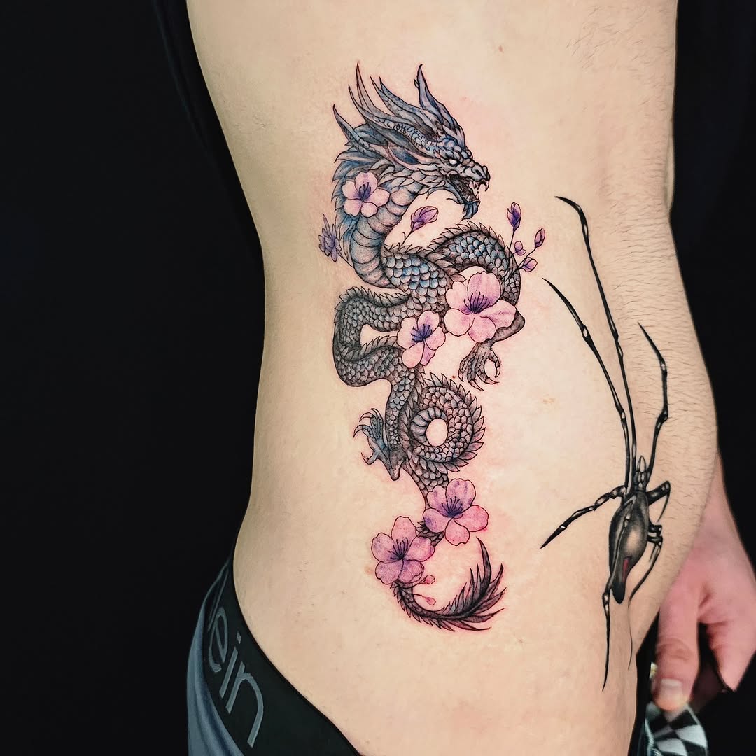 Dragon and cherry blossoms japanese irezumi tattoo on the ribs by Lili Gu