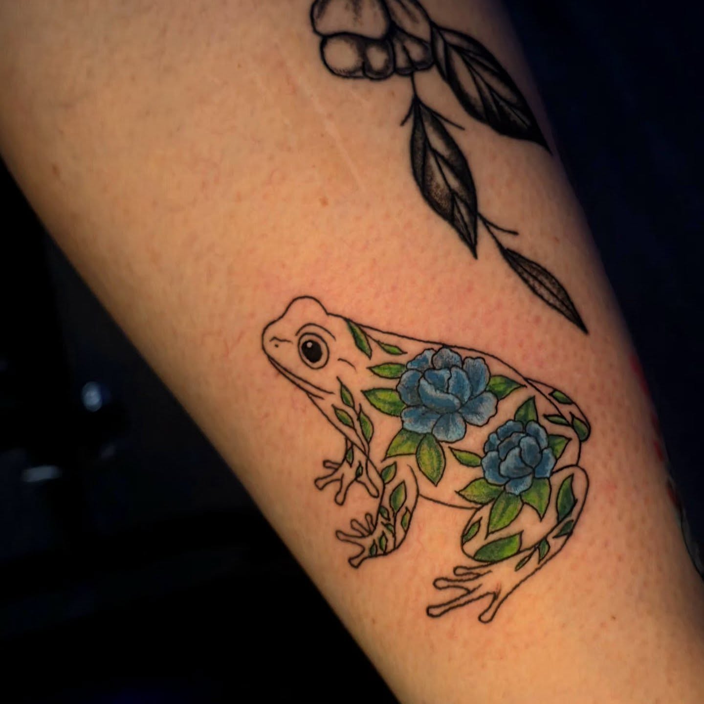 Frog with flowers new school tattoo on the forearm by Karley Michelle Moody