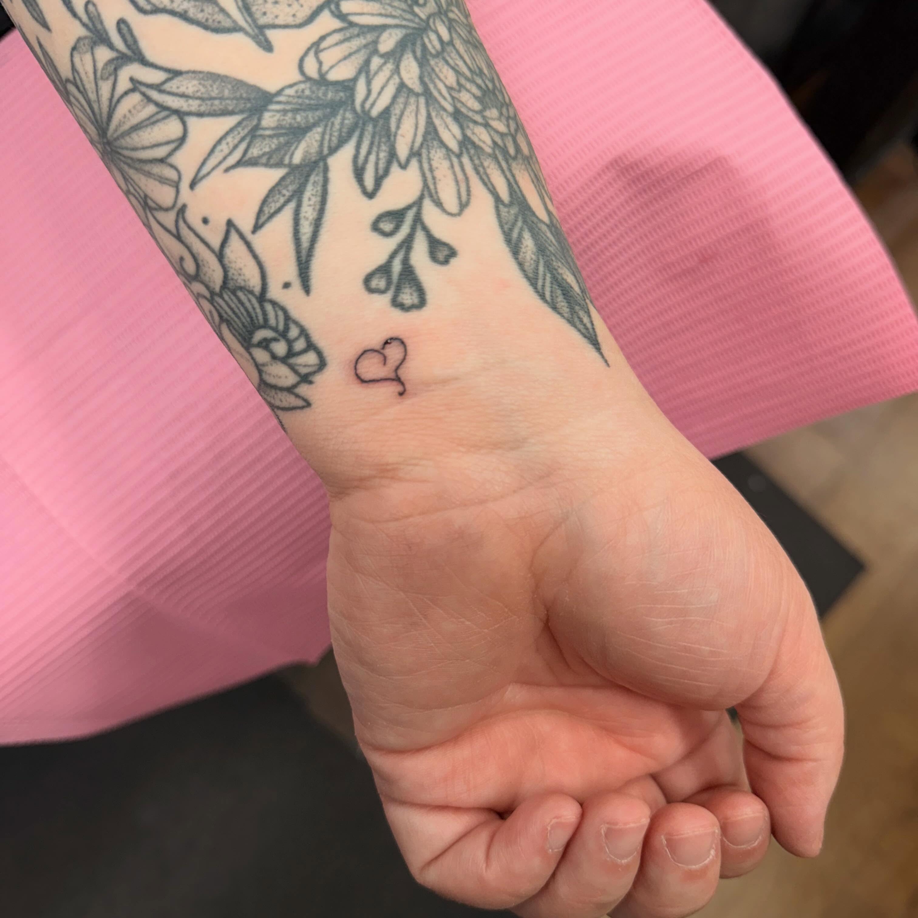 Floral arrangement dotwork tattoo on the forearm by Erica Rose π€