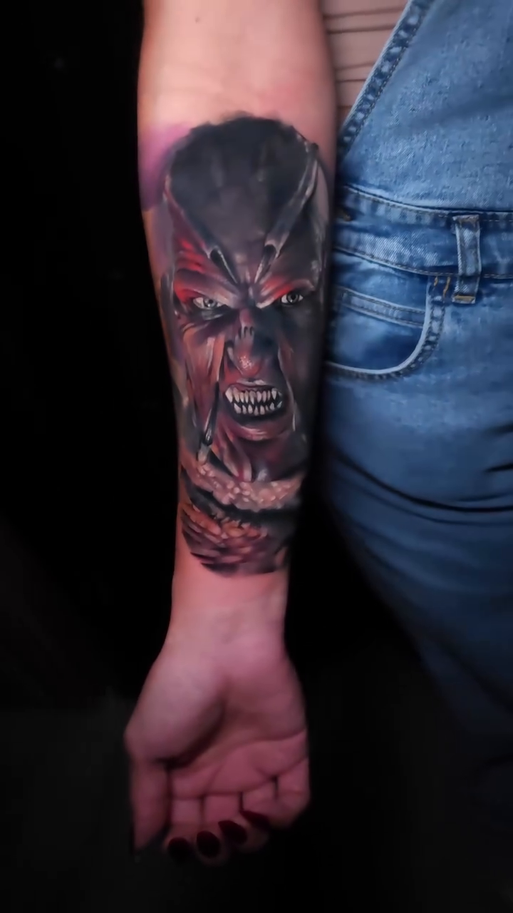 Demonic face tattoo realism tattoo on the forearm by Joseph J Tattooart Denver, Lakewood, Colorado