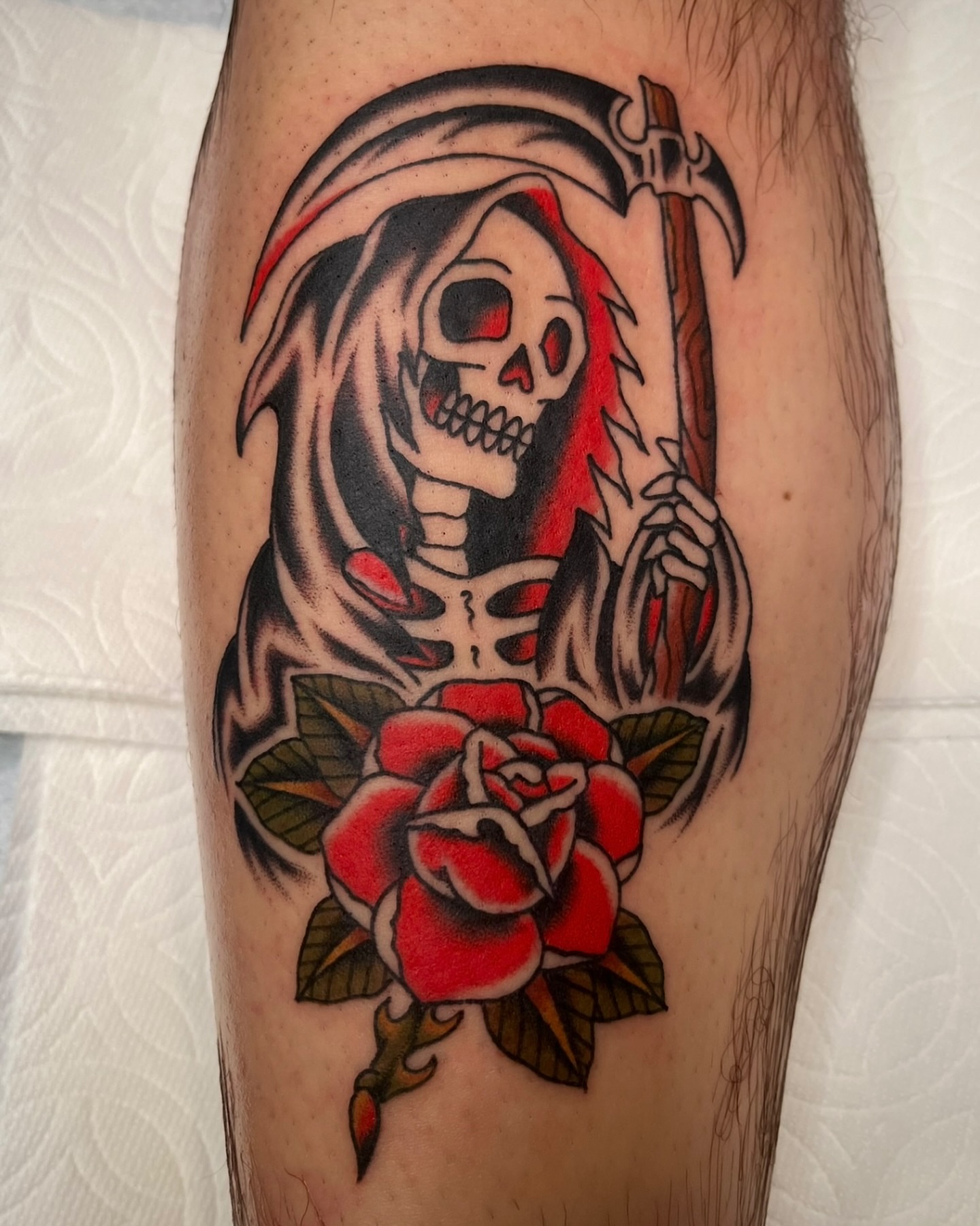 Reaper with rose American traditional tattoo on the forearm by Tiffani Thompson, San Diego, California