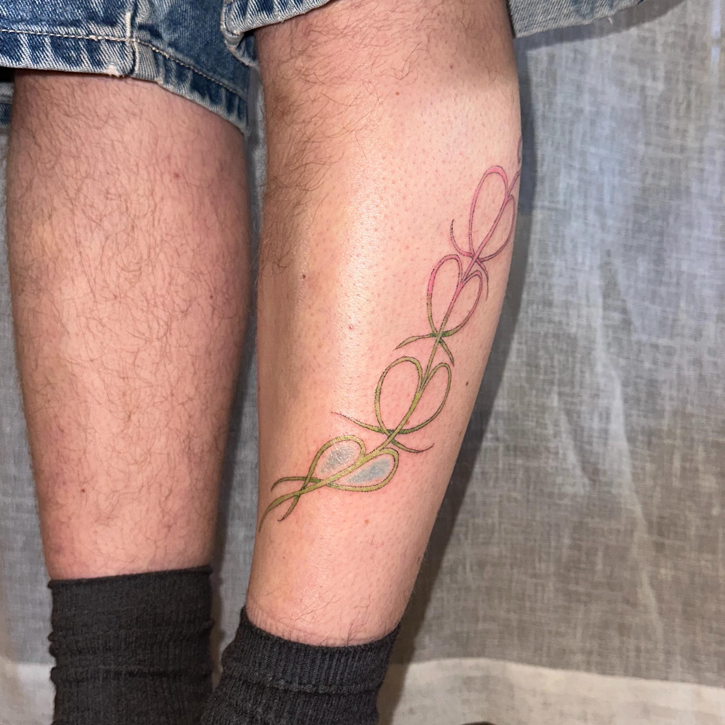 String fine line tattoo on the calf by kate