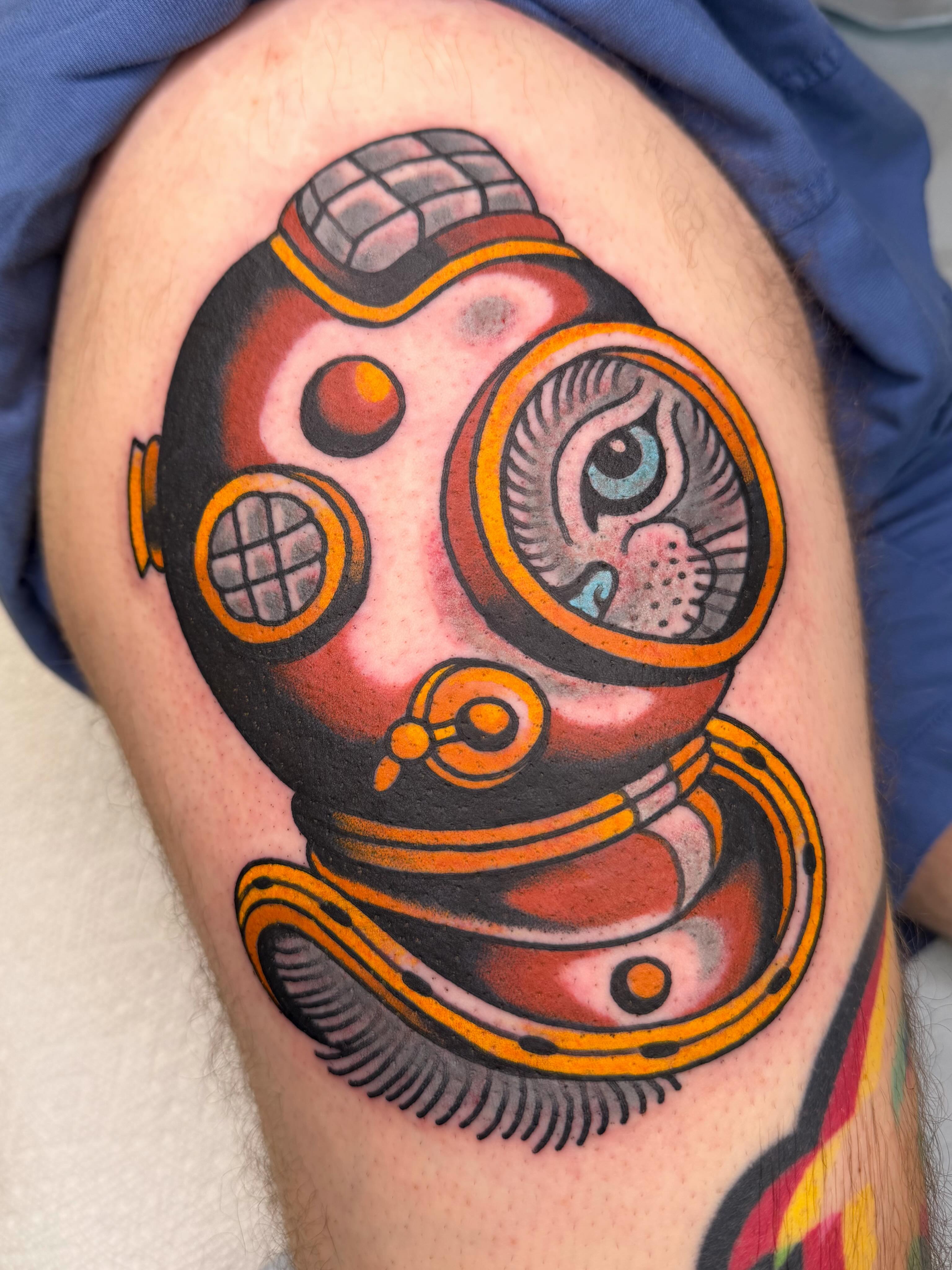 Diving helmet American traditional tattoo on the thigh by Danny Reed, Asheville, North Carolina
