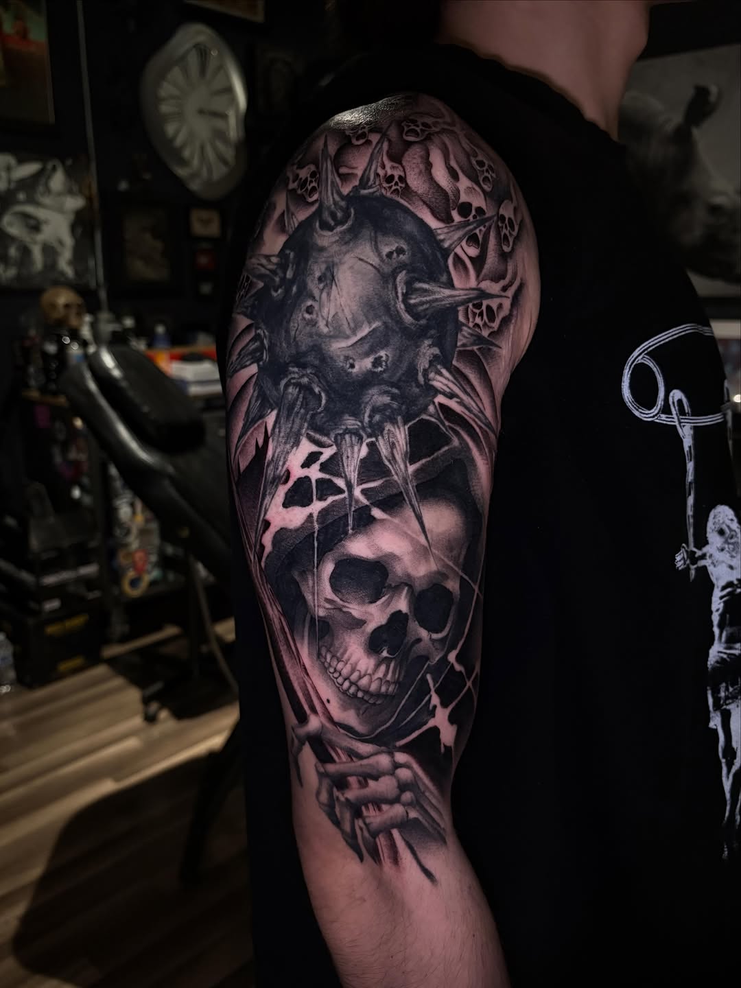Skull and spiked ball realism tattoo on the upper arm by Savana ☆