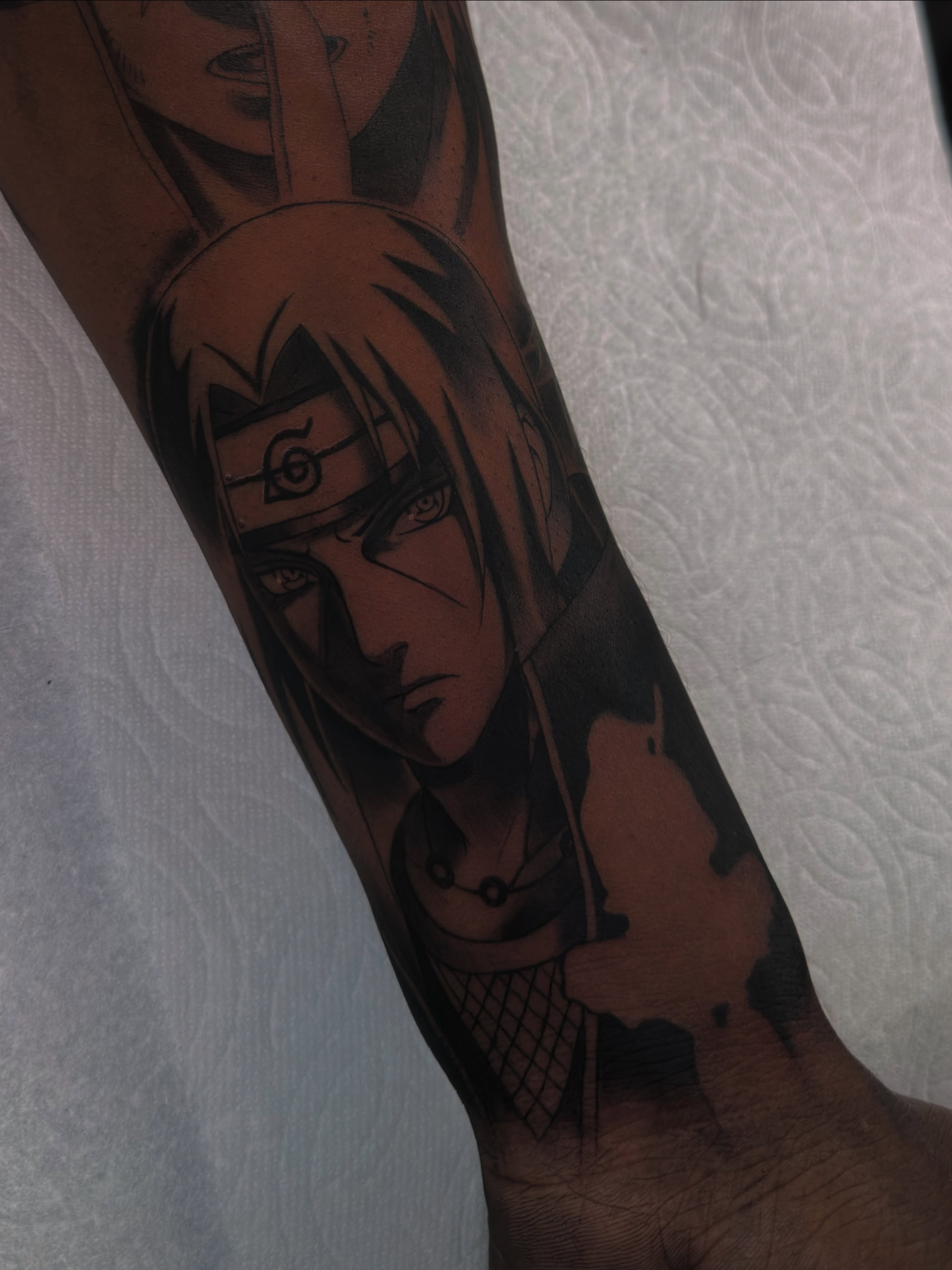 Anime character anime tattoo on the forearm by Mando