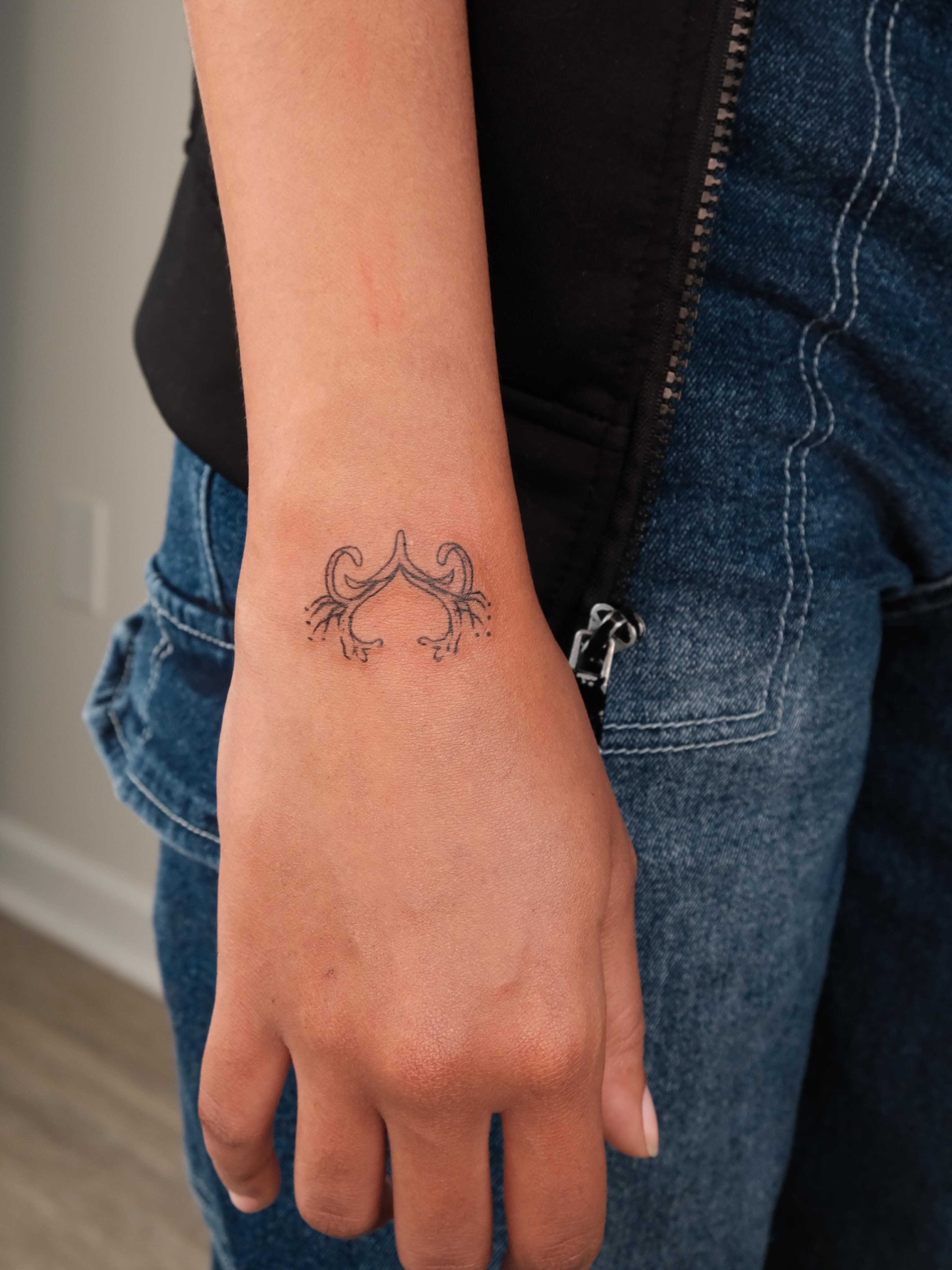 Scorpion geometric tattoo on the forearm by Elana Hites