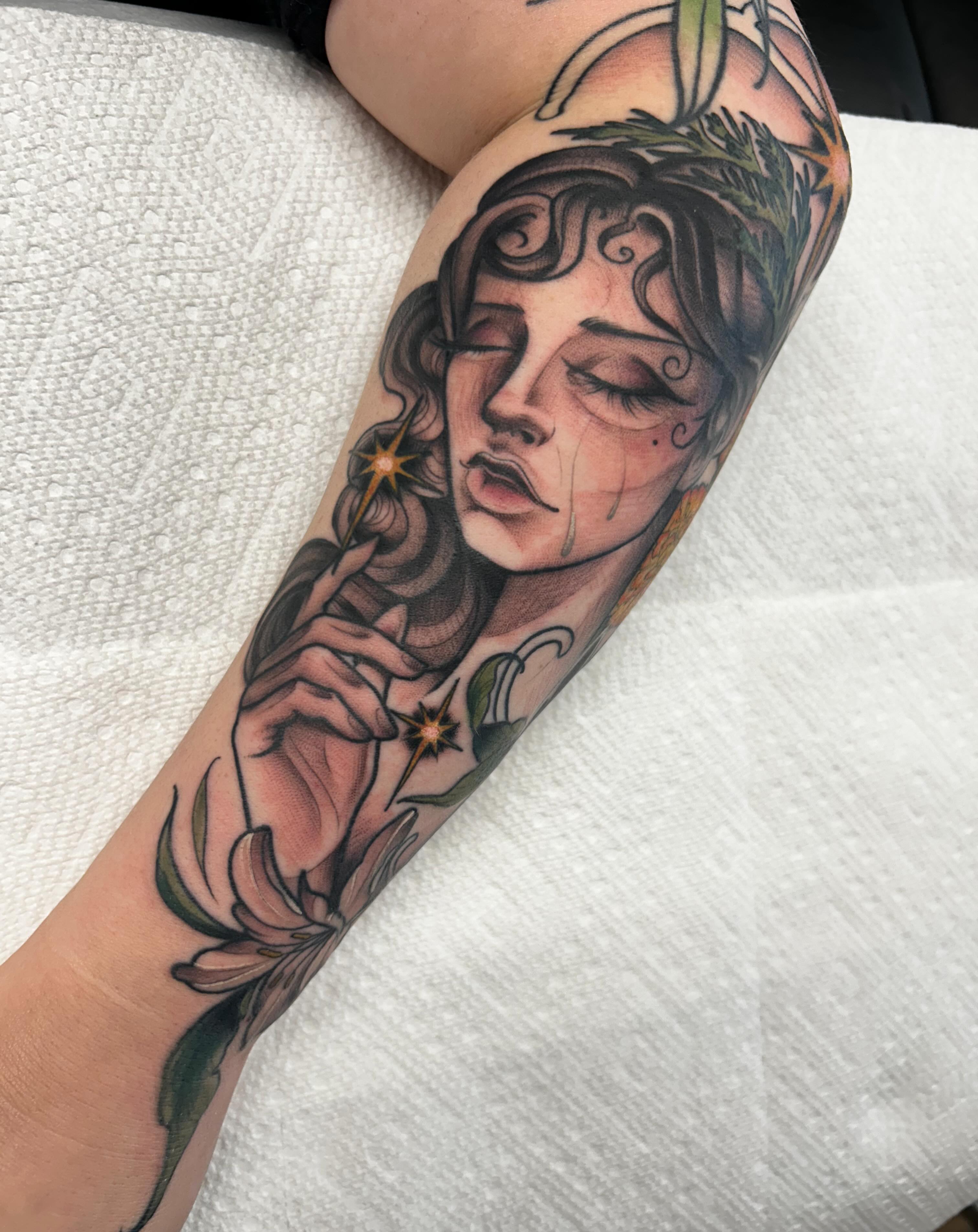 Woman with stars realism tattoo on the forearm by Kayla Fay, Baton Rouge, Louisiana