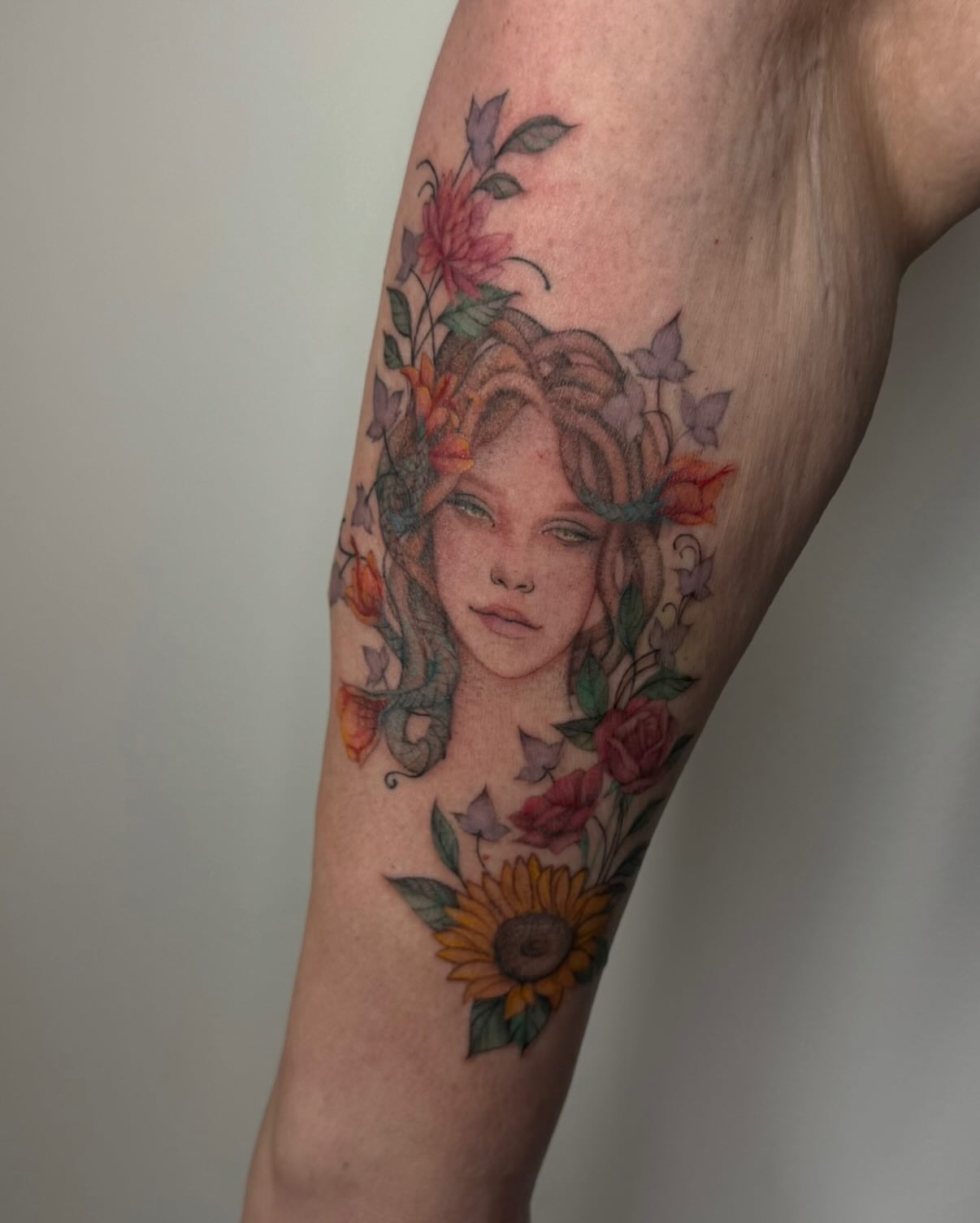 Floral portrait realism tattoo on the forearm by Carson Mccullers ✨