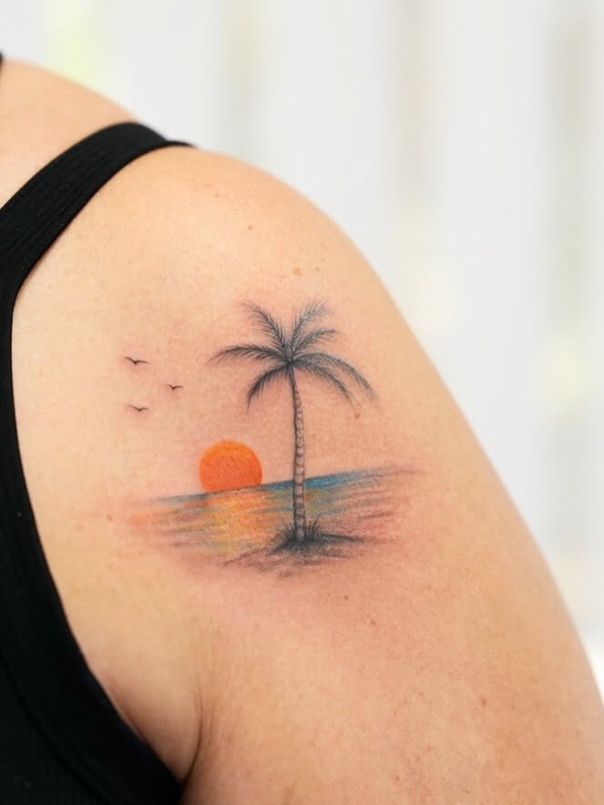Sunset with palm tree realism tattoo on the shoulder by New Root Ink _Studio