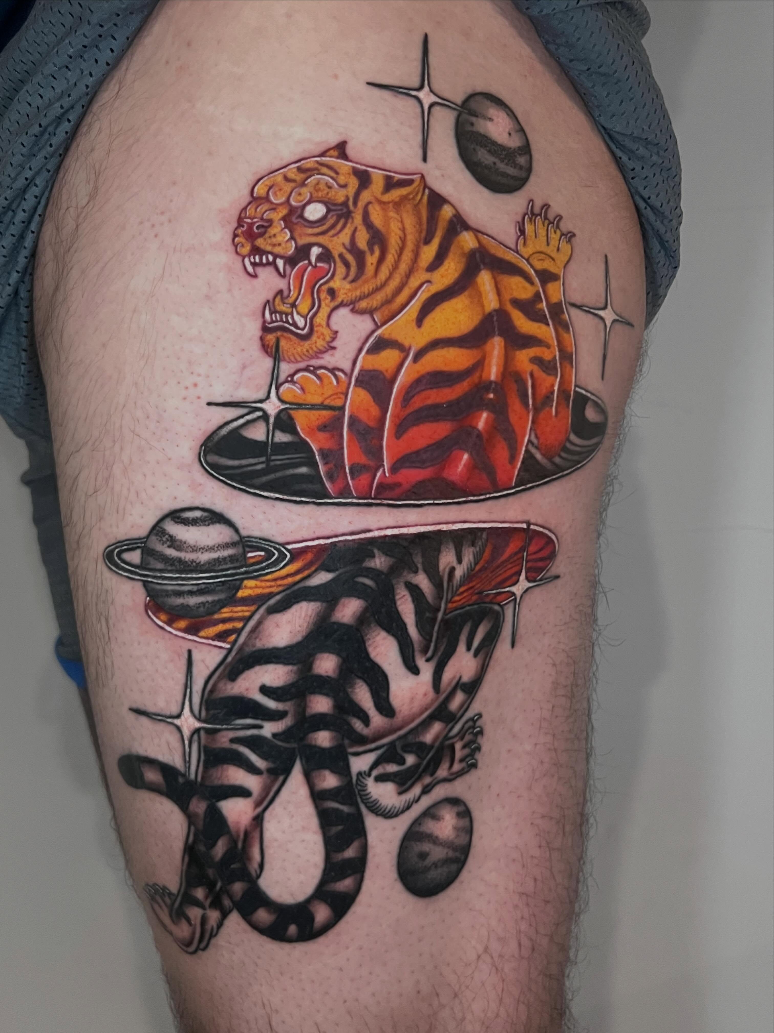 Tiger and planets realism tattoo on the thigh by Eoghann McGregor