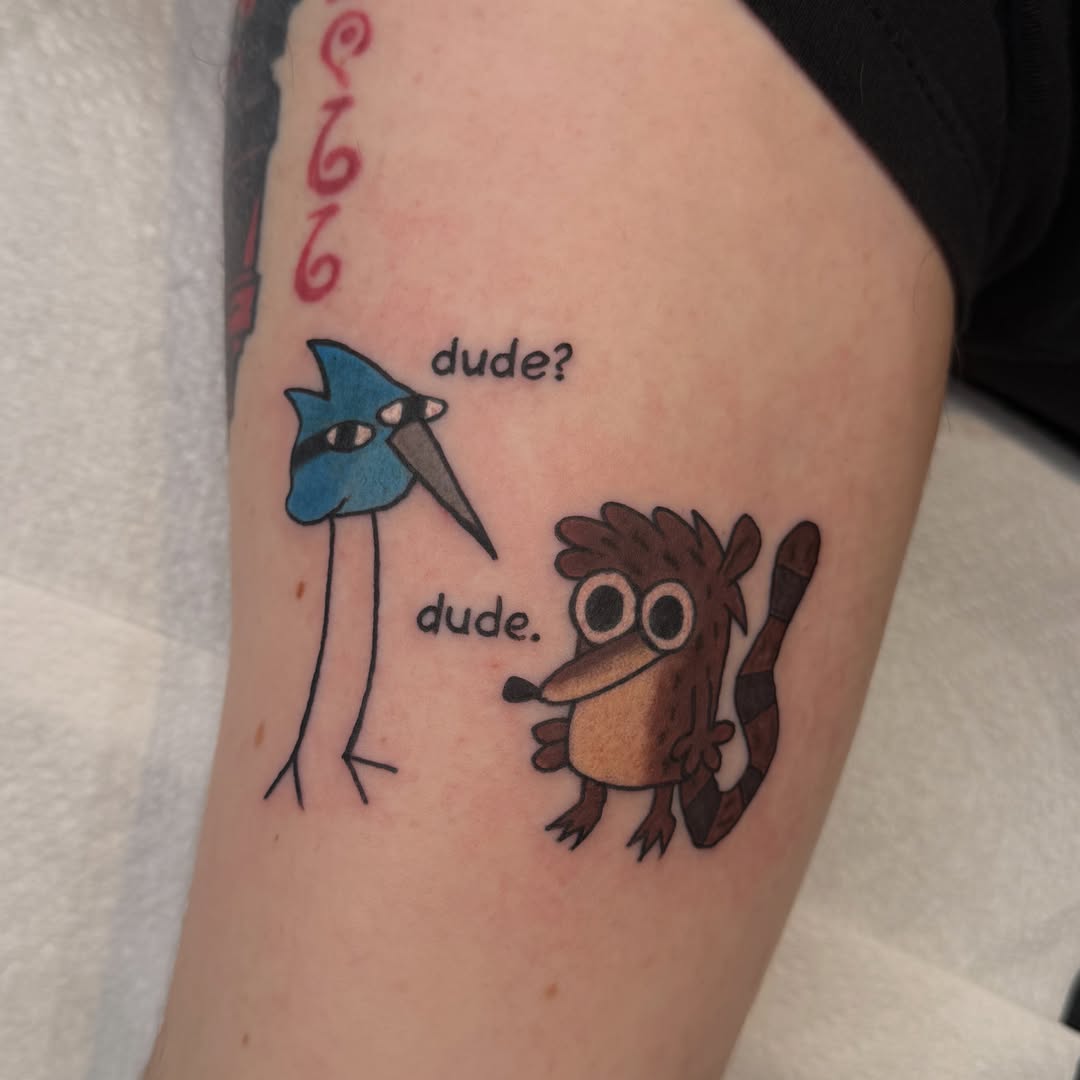 Bird and raccoon illustrative tattoo on the forearm by Mercy Dean