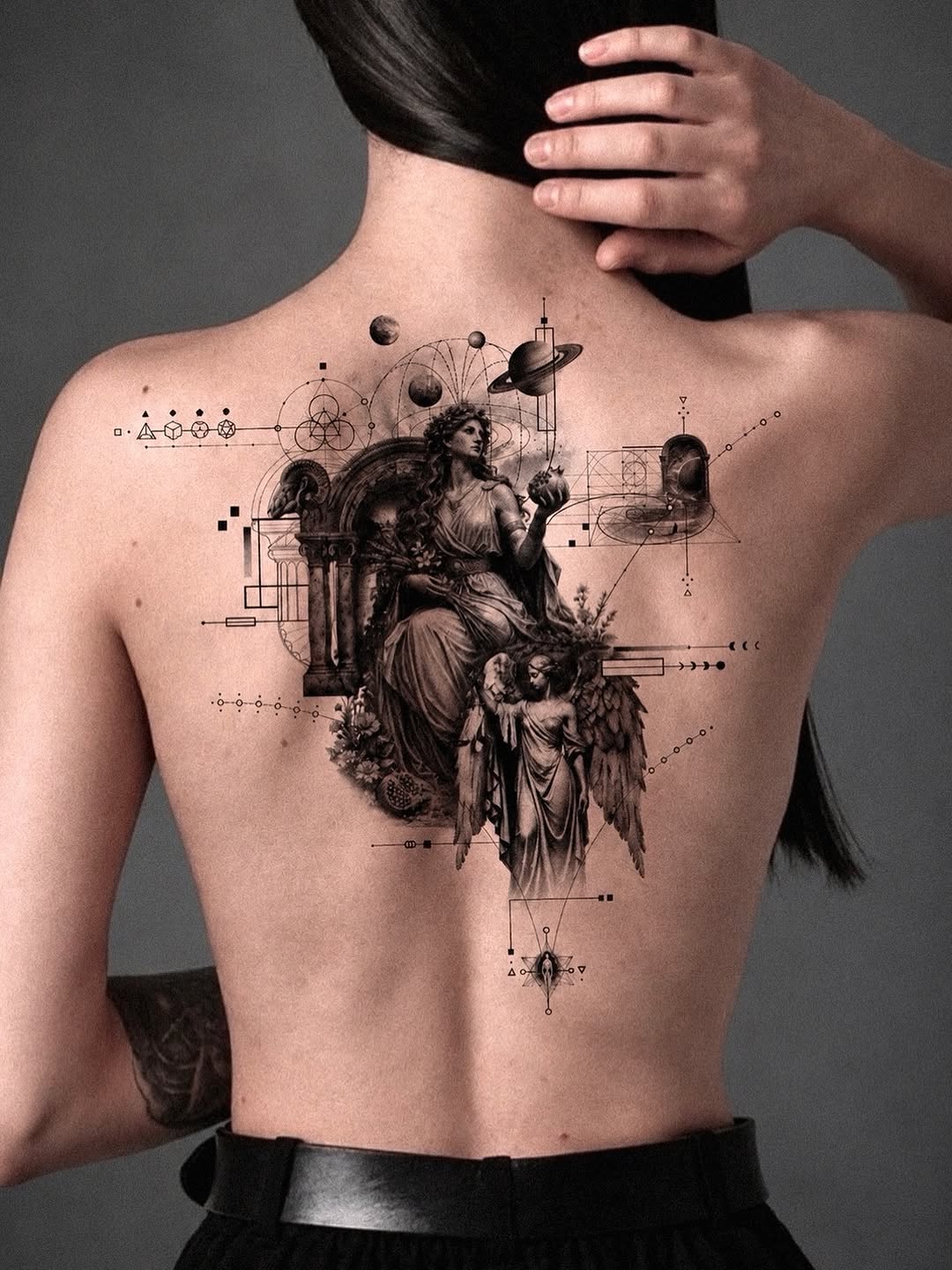 Goddess with angel and celestial elements sketch tattoo on the back by Seraph Geometry