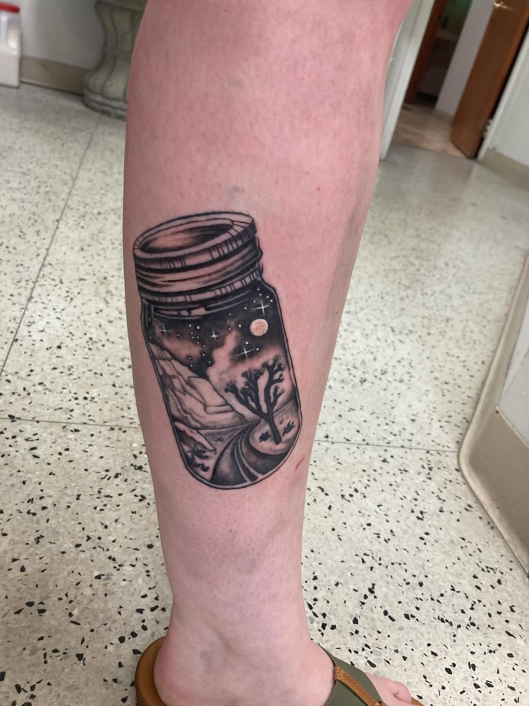 Fine line tattoo on the calf by Timothy Murtaugh
