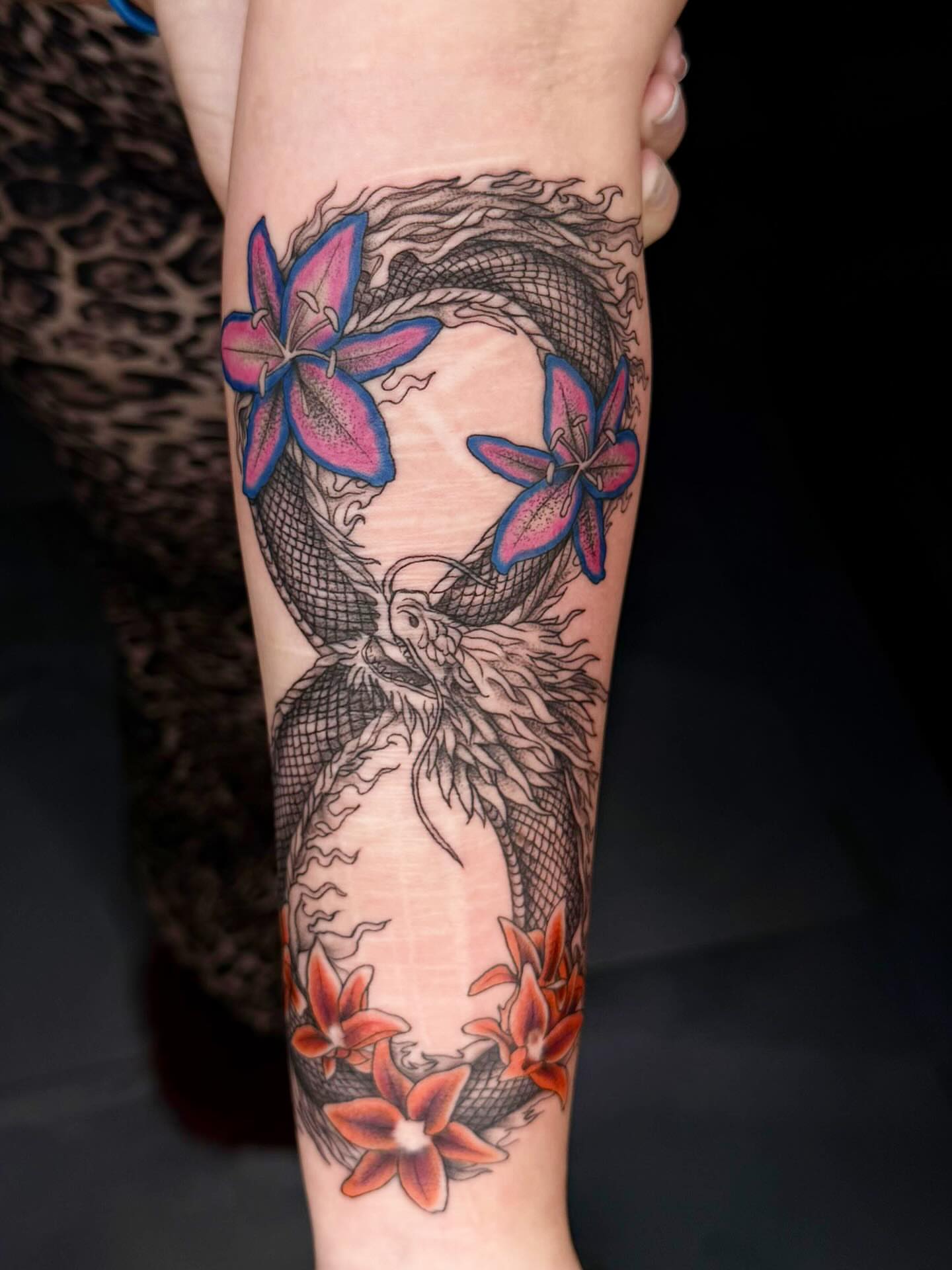 Mermaid and flowers new school tattoo on the forearm by Exis LHinc, Miami, Florida