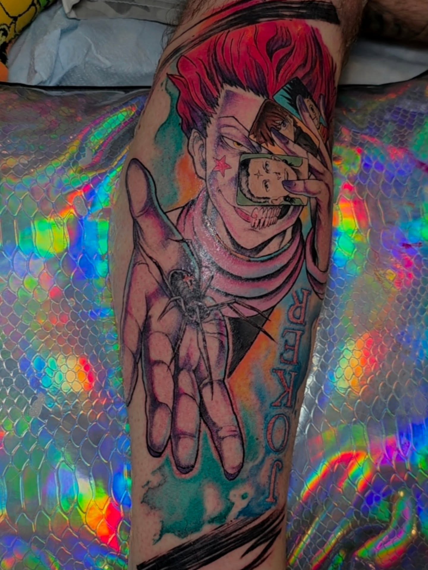 Joker anime tattoo on the forearm by Krystal Harris