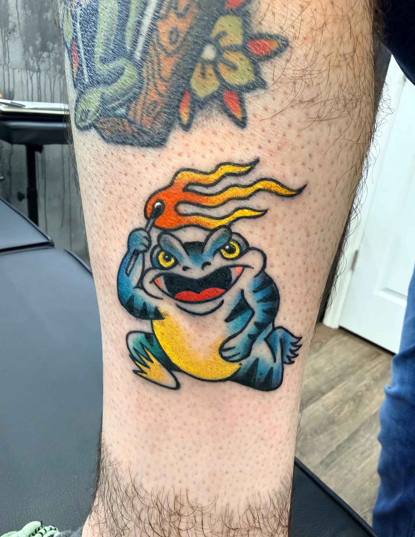 Frog with flame American traditional tattoo on the forearm by Chris