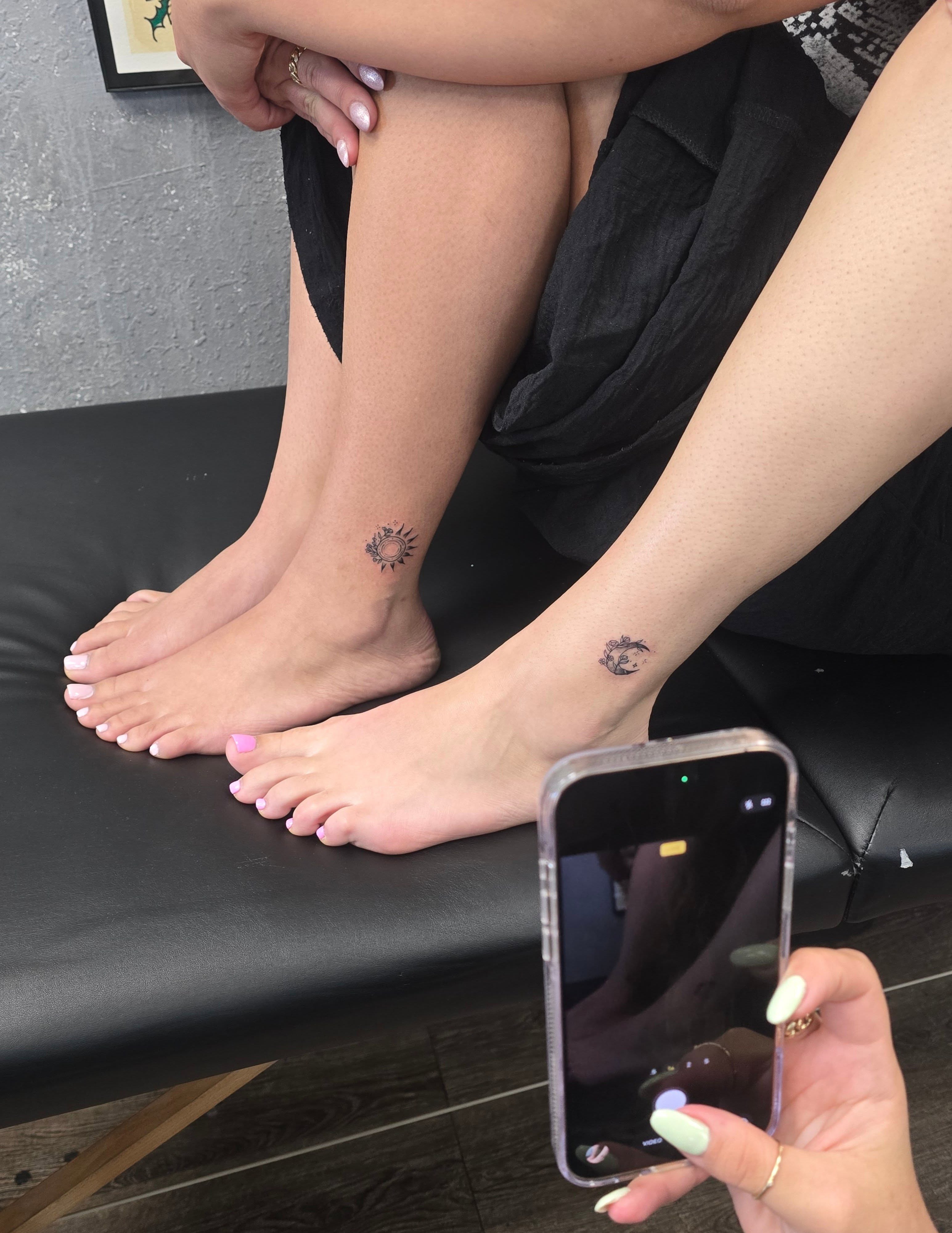 Sun black and grey tattoo on the foot by Chris
