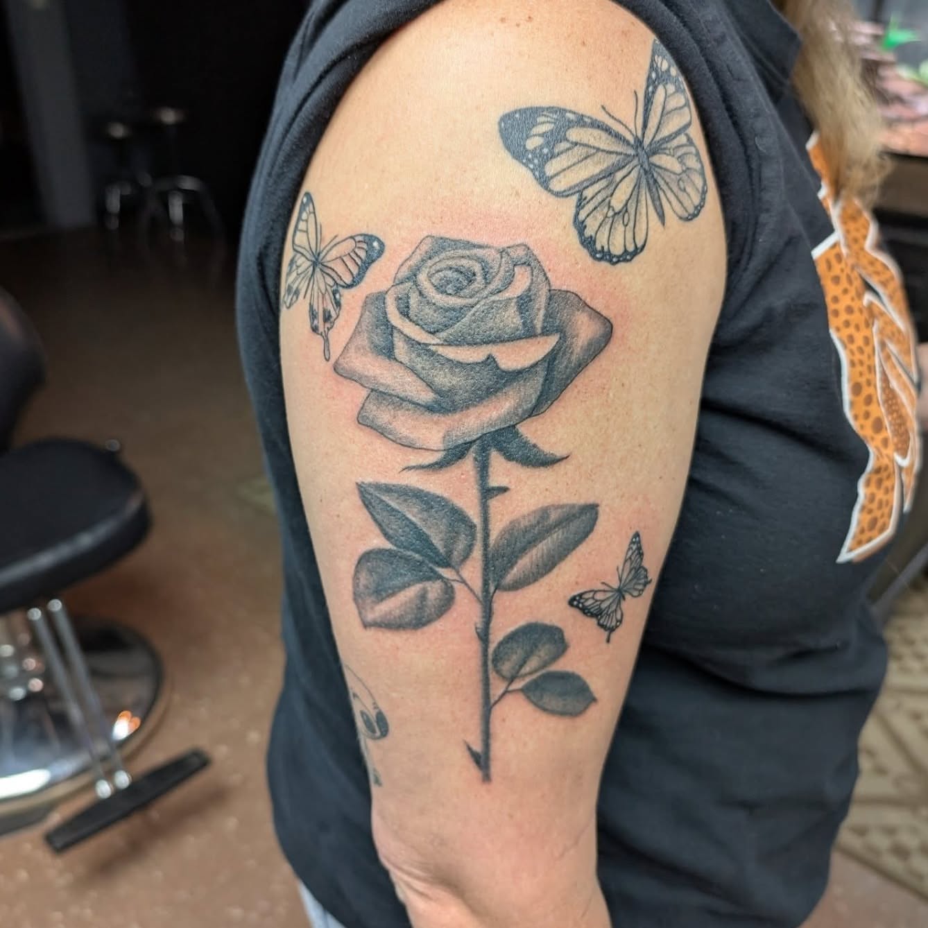 Rose and butterflies realism tattoo on the shoulder by Ben Cecil, Summerville, South Carolina