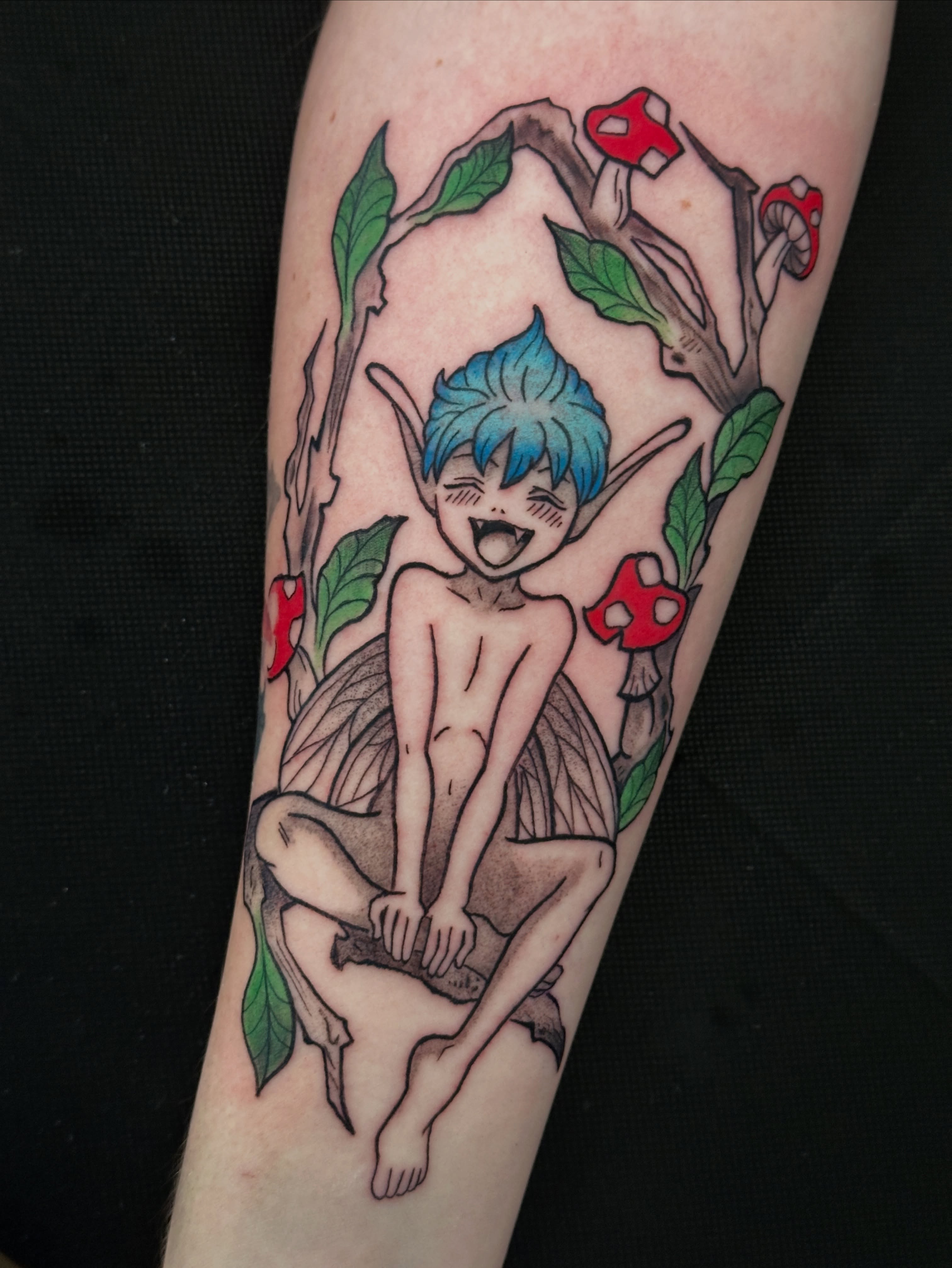 Elf-like creature anime tattoo on the forearm by Dustin Hughes
