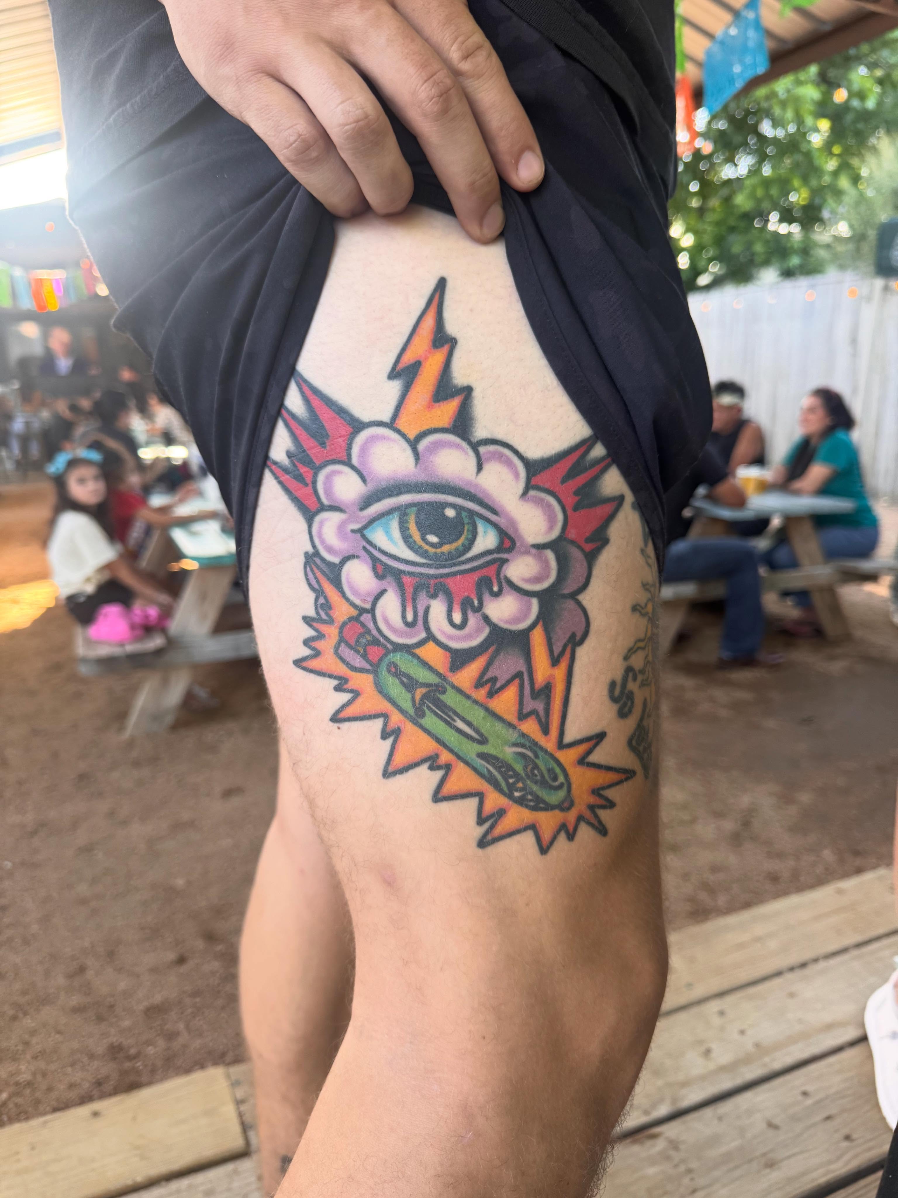 Eye with lightning bolt American traditional tattoo on the thigh by Jonathan Clapp, San Antonio, Texas