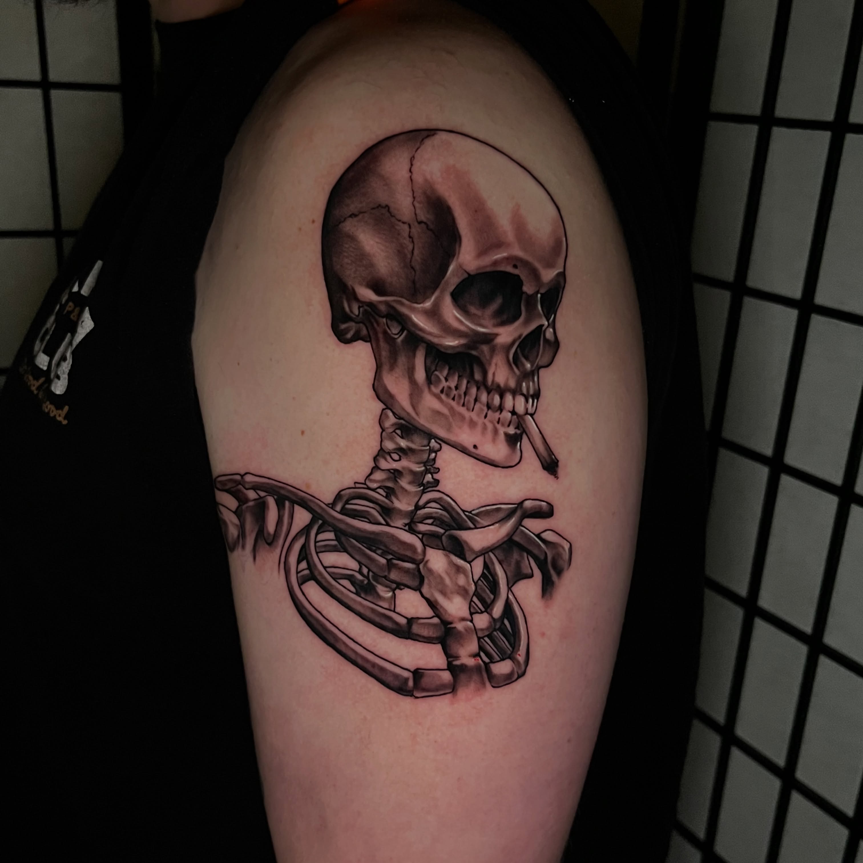 Skull and skeleton realism tattoo on the shoulder by Mant